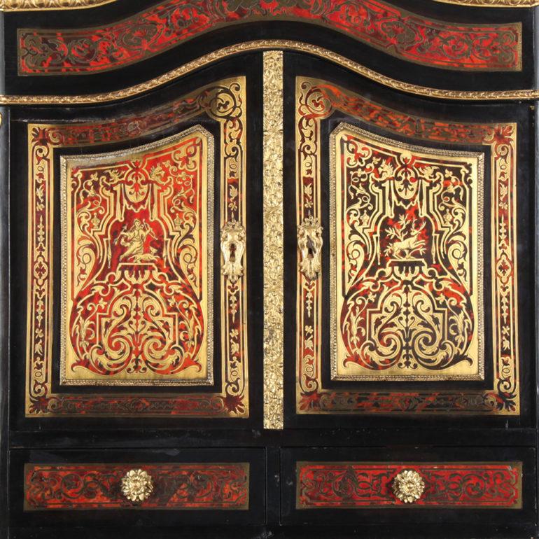 A lovely and rare French ebonized and boulle writing desk or ‘bonheur du jour’, the lower desk fitted with a drawer and pull-out writing surface, the upper section with two small drawers and a cabinet, the whole raised on serpentine cabriole legs