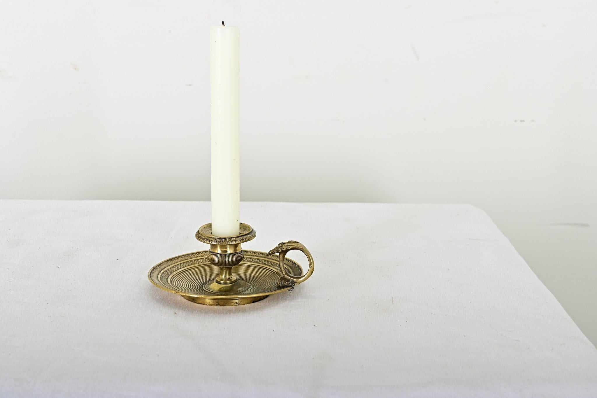 A charming French 19th century brass chamberstick of meticulous patterning covering nearly all of the surface with great patina. The saucer base and ring for carrying would indicate this is a “chamberstick” meant for one’s bedside rather than a