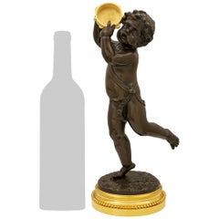 French 19th century Bronze and Ormolu statue of a cherub, signed Clodion