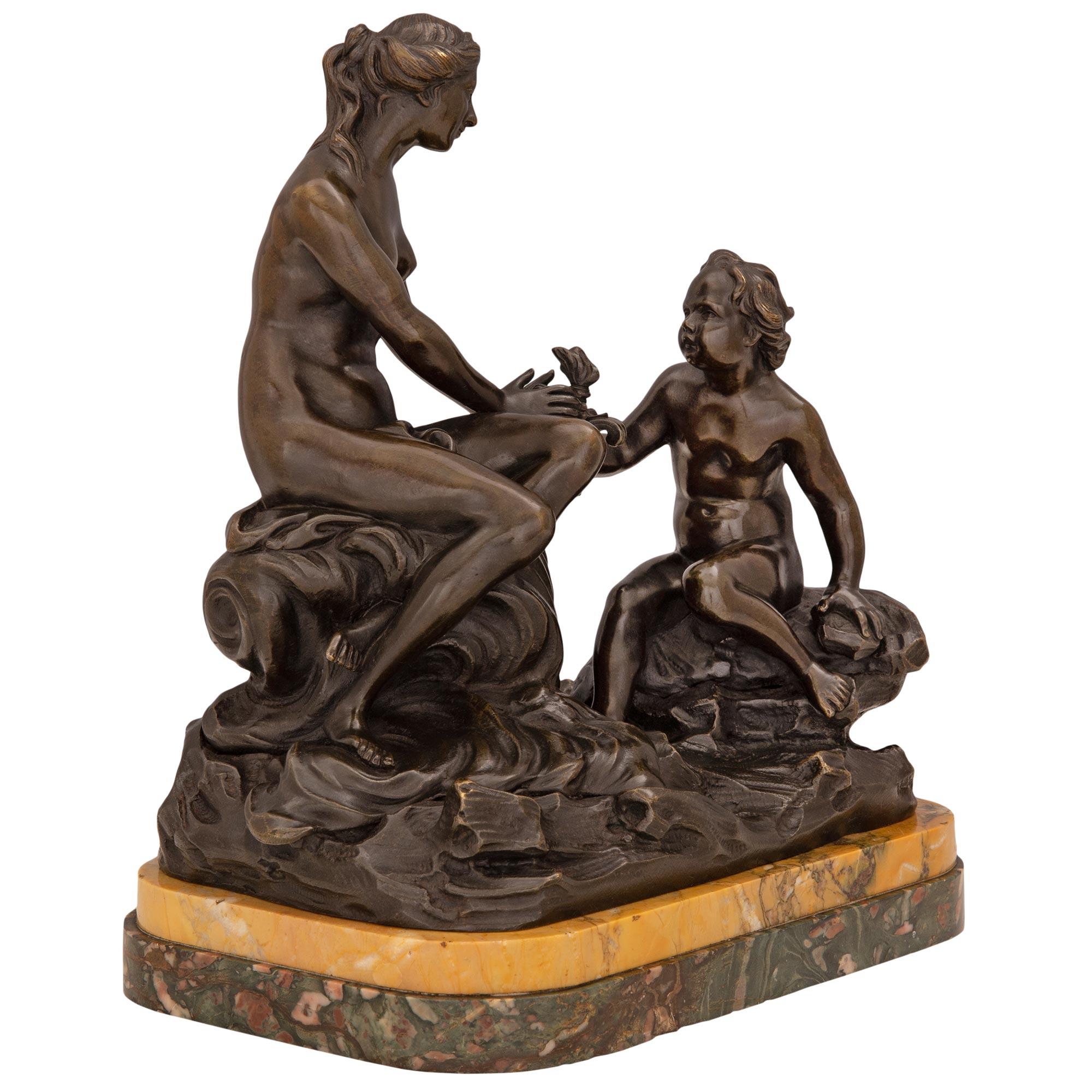 A striking French 19th century patinated bronze, Breccia de Pavonazza and Sienna marble statue. The impressive statue is raised by a beautiful Breccia de Pavonazza and Sienna marble base with a fine stepped design. The richly chased bronze above