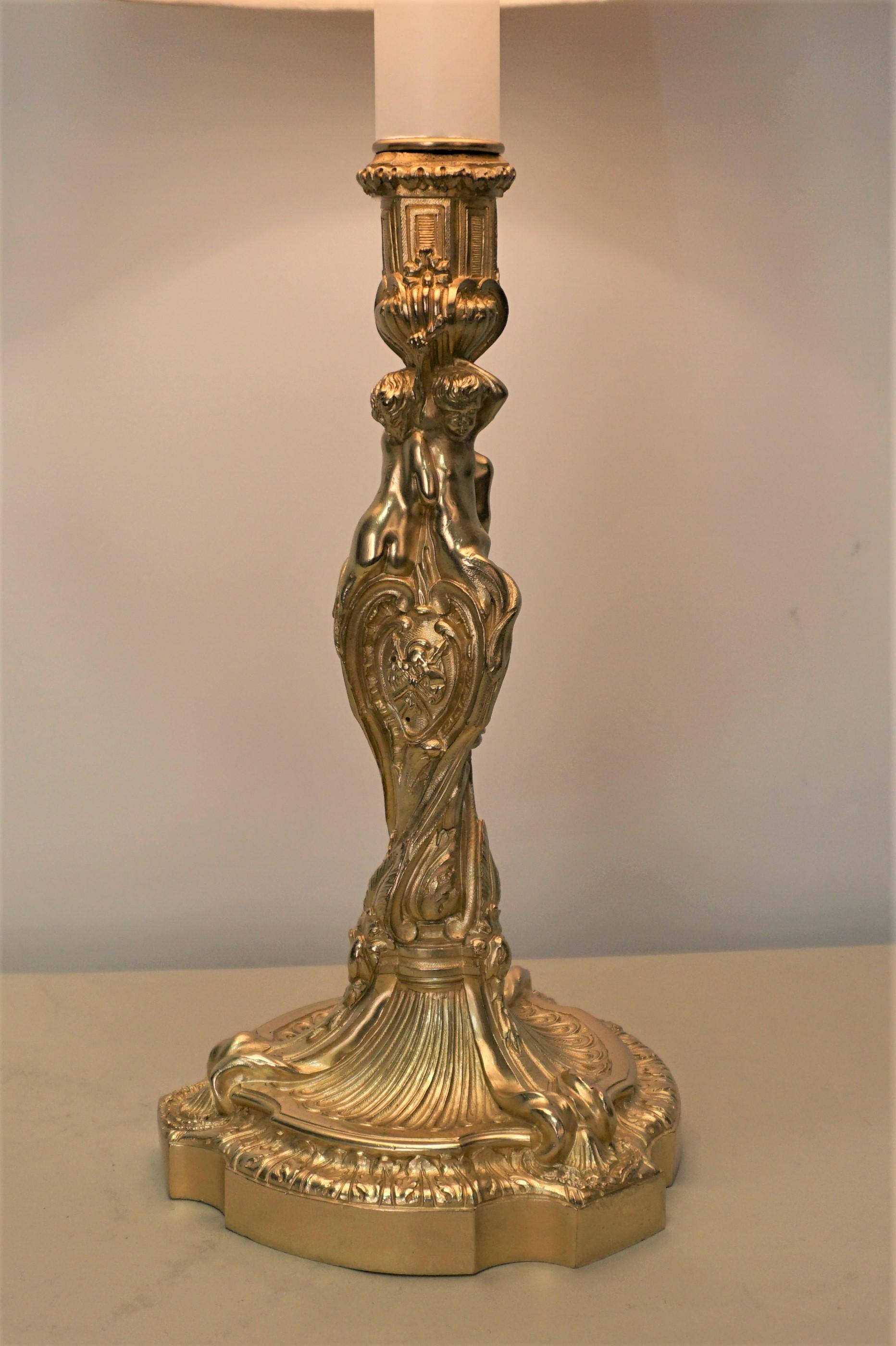 French 19th century electrified bronze candlestick lamp fitted with box pleat silk lampshade.