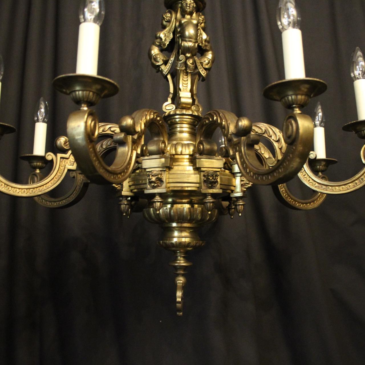 A French gilded bronze eight-light antique Mazarin chandelier, the decoratively clad acanthus leaf square gauge scrolling arms with circular bobeches drip pans, issuing from an ornate triple female supporting caryatids central column, lion mask