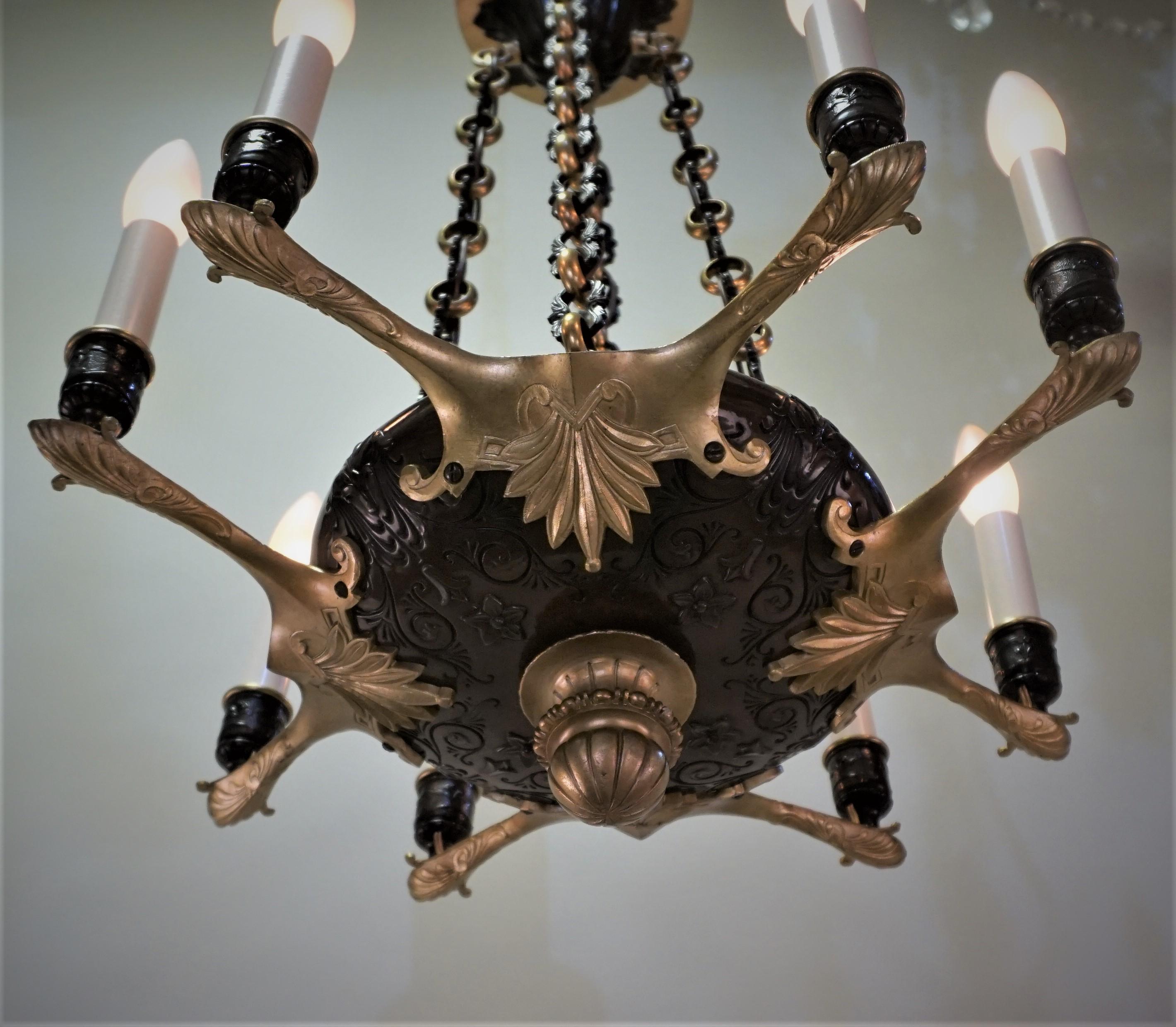 Elegant eight-light 19th century Empire style bronze chandelier.