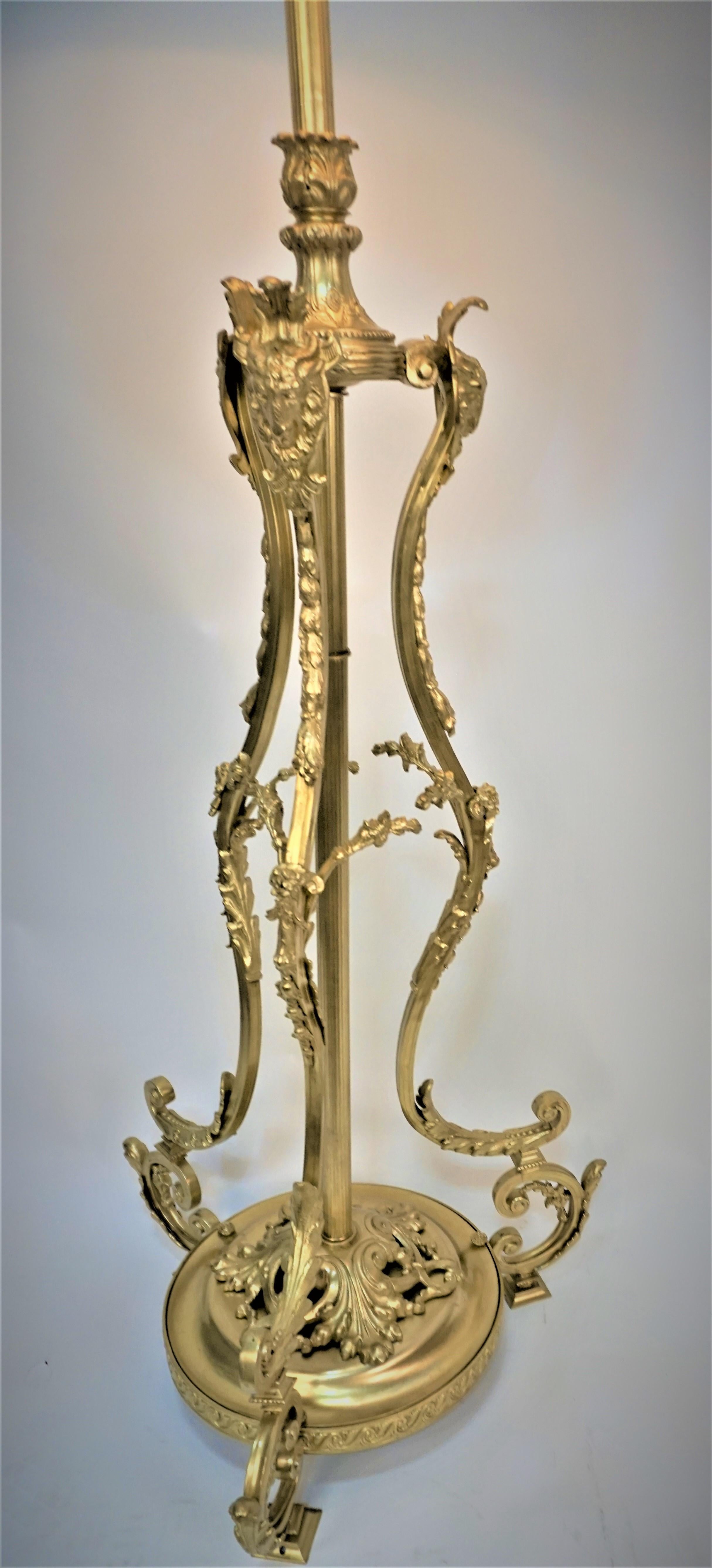 19th century bronze floor lamp that originally was oil burning, oil container has been removed and professionally has been wired with four pull chain socket and fitted with 22