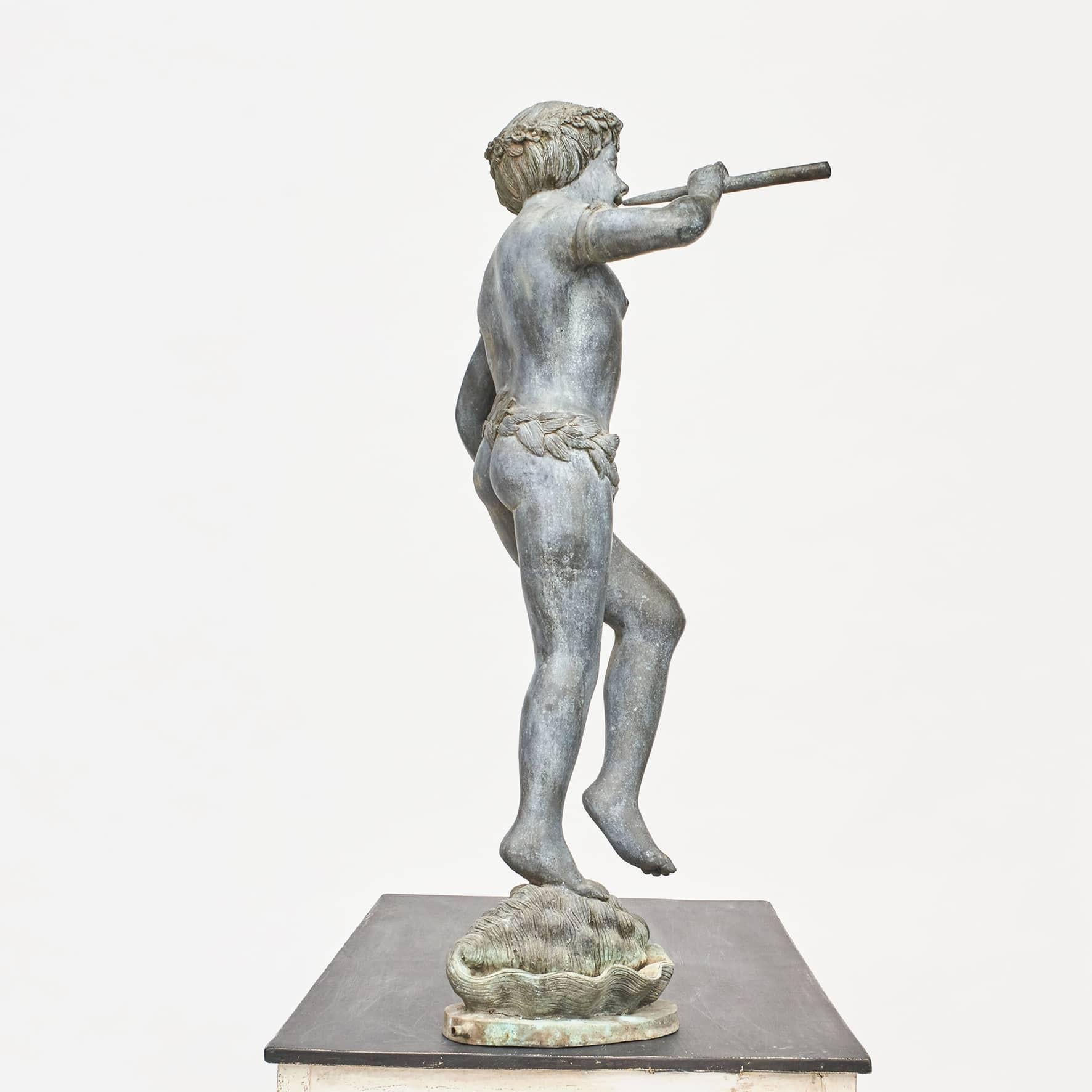 French patinated bronze garden fountain with figural boy playing flute while standing on a sea shell.
The water springs from the flute.
Nice patina.
French School, France 19th century.
