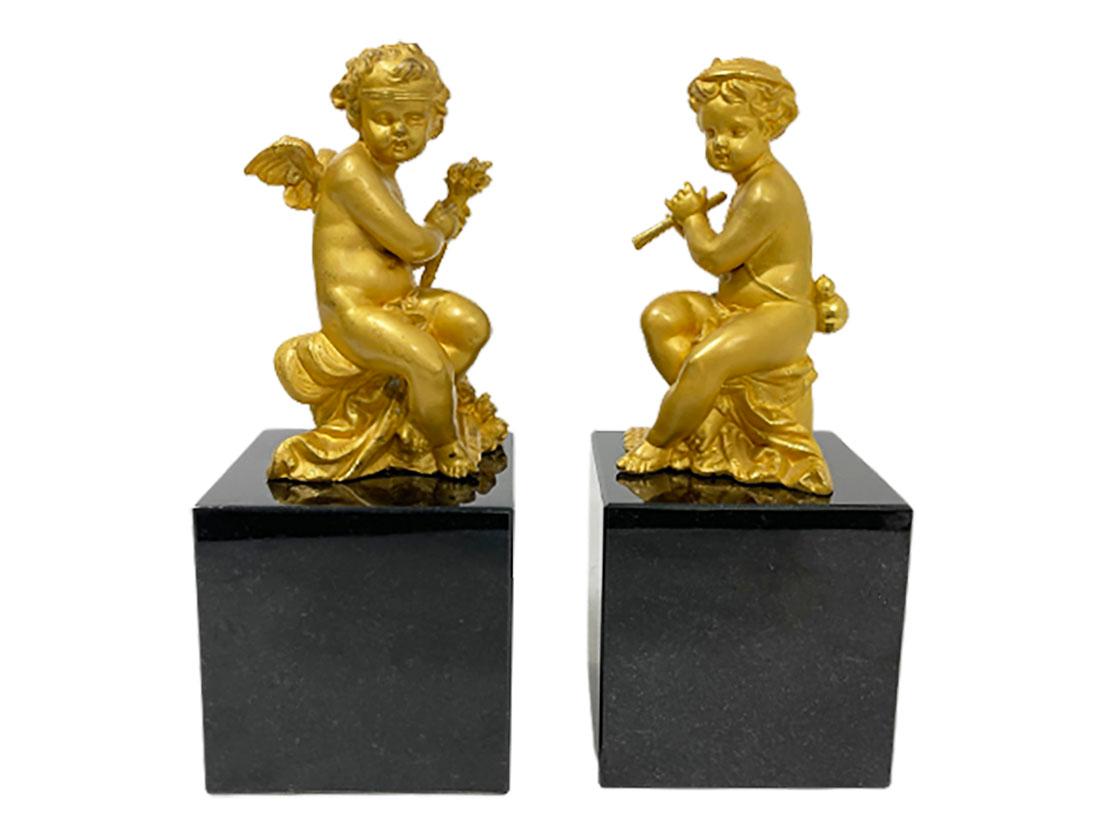 French 19th century bronze gilt putti

A set of bronze putti figures on a square marble base. A torch and a flute carrying putti, which are graceful objects, but can also be used as bookends. 
The measurement is 24.5 cm high with the base.
The