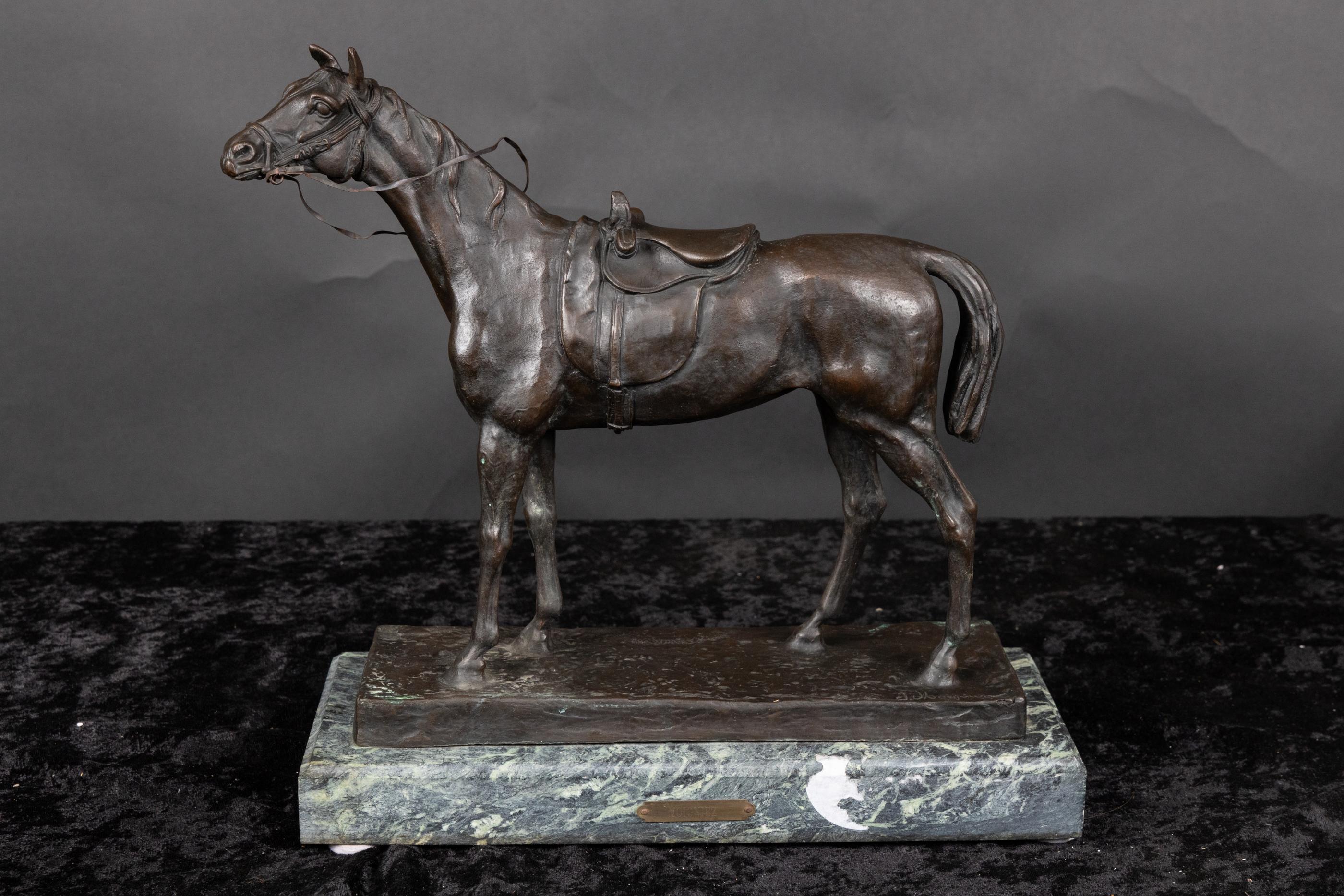 French 19th century bronze horse, signed J. Moigniez, mounted on marble base with plaque that has his name.  The sculpture is detailed with the saddle, reins, and bit in the horse’s mouth.  Jules Moigniez was known for the exquisite bronzes he made