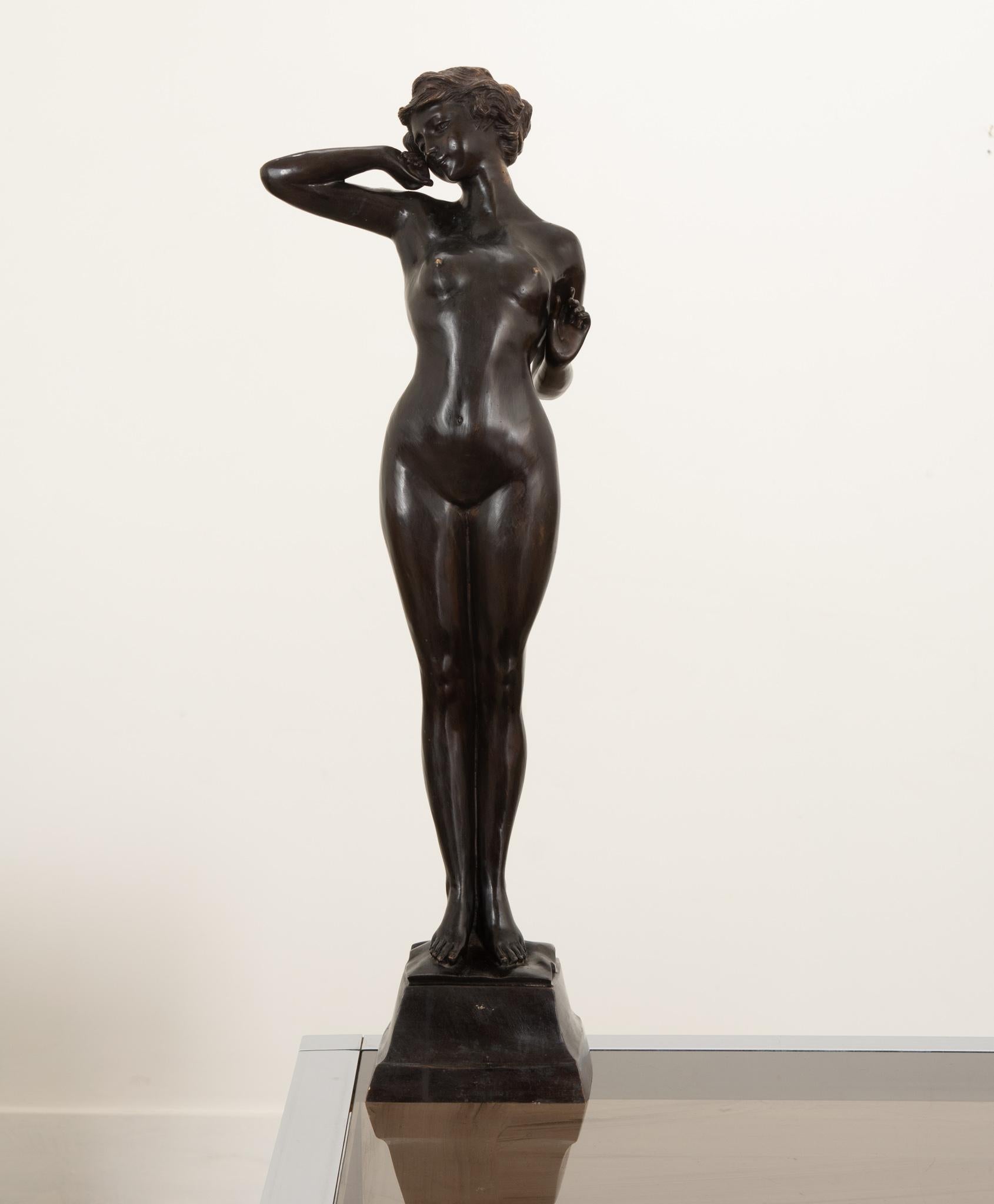 A beautiful bronze female nude crafted in France during the 19th century. The composition is well balanced, the figure in a classic stance to show off the artist's ability to recreate her anatomy. Wonderfully patinated. Make sure to view the