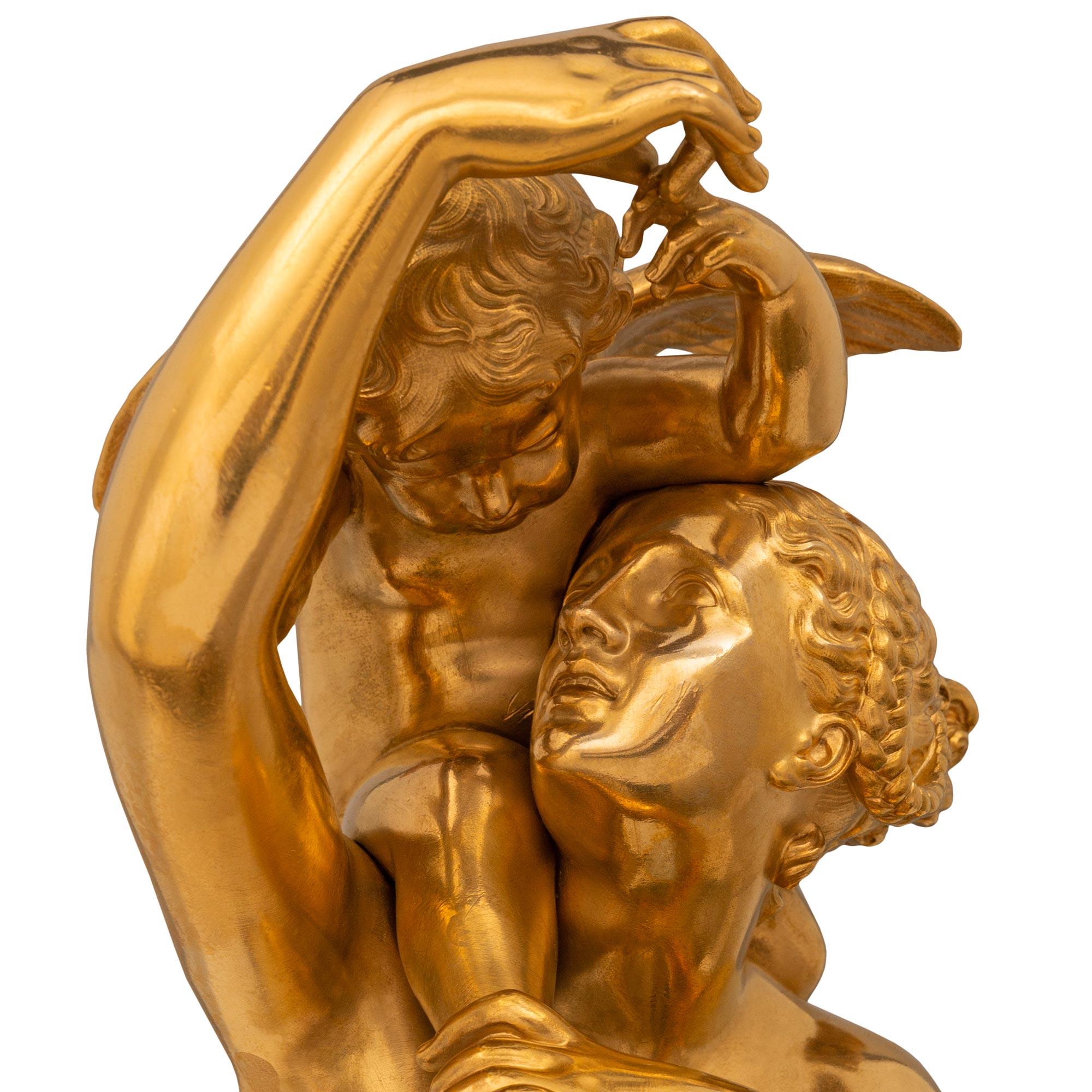 A wonderful and finely detailed French 19th century Ormolu and Patinated Bronze statue titled Allegorie de L'amour Maternel, signed Fraikin and Vittoz. The stunning statue's title means 