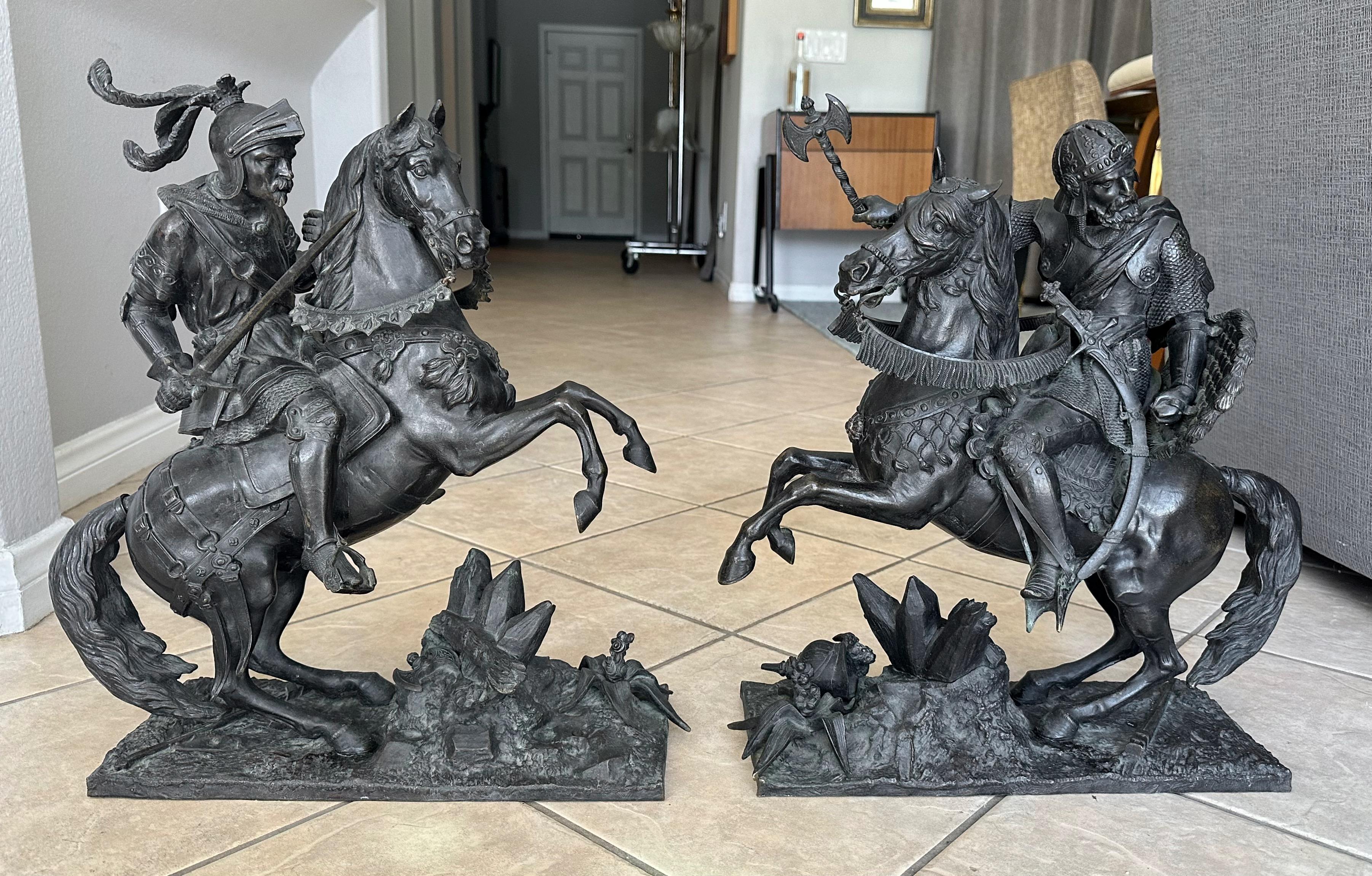 Pair of 19th century dark patinated bronze statues depicting Renaissance period (possibly Medieval) Knights in battle each on horseback. Expertly chased with intricate detailing throughout with each weighing close to 40 pounds. Unsigned. 
