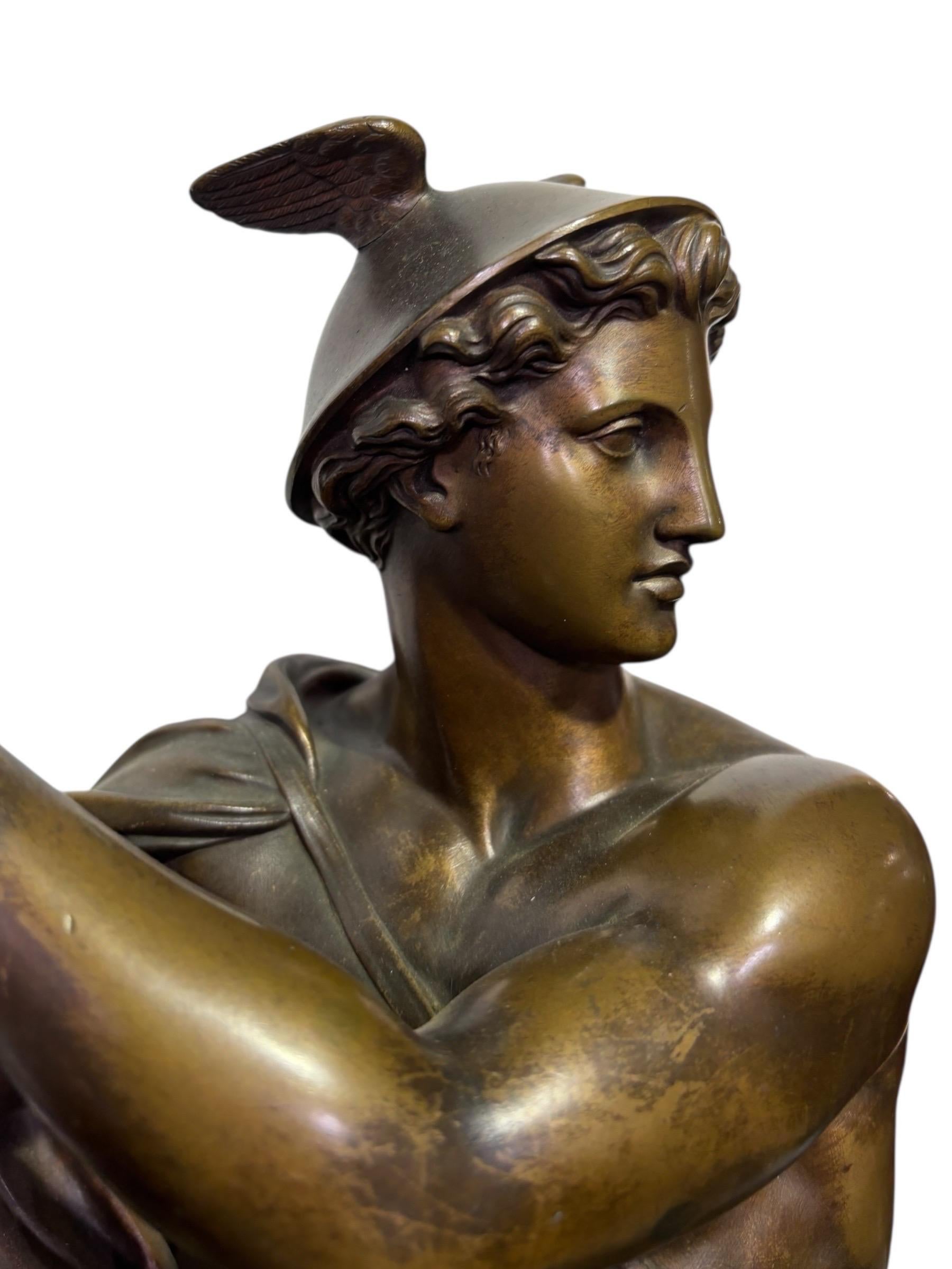 French 19th century patinated bronze statue of Hermes, signed Elias Roberts. Raised on a rectangular base, Hermes is seated on tied cushions, wearing his winged hat and sandals, his draped cloak billowing behind him. His hands, which hold a small