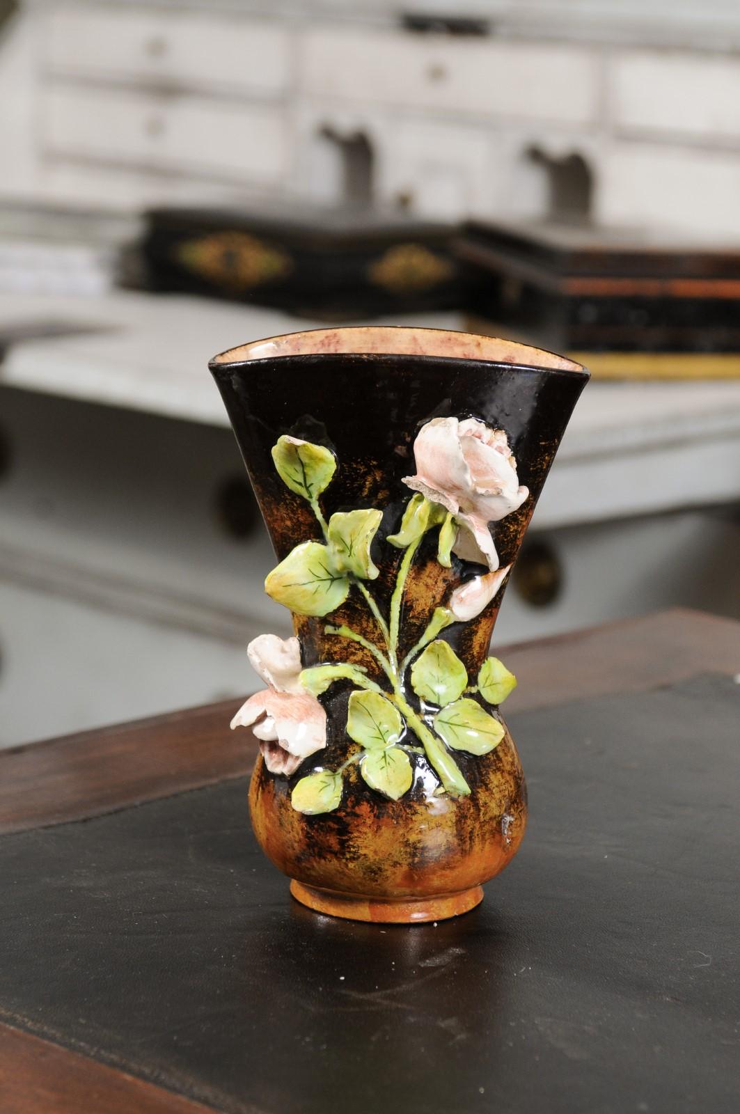 A French barbotine vase from the 19th century, with high relief floral décor. Created in France during the 19th century, this barbotine vase features a high relief floral décor made of delicate pink roses and their green leaves, standing out