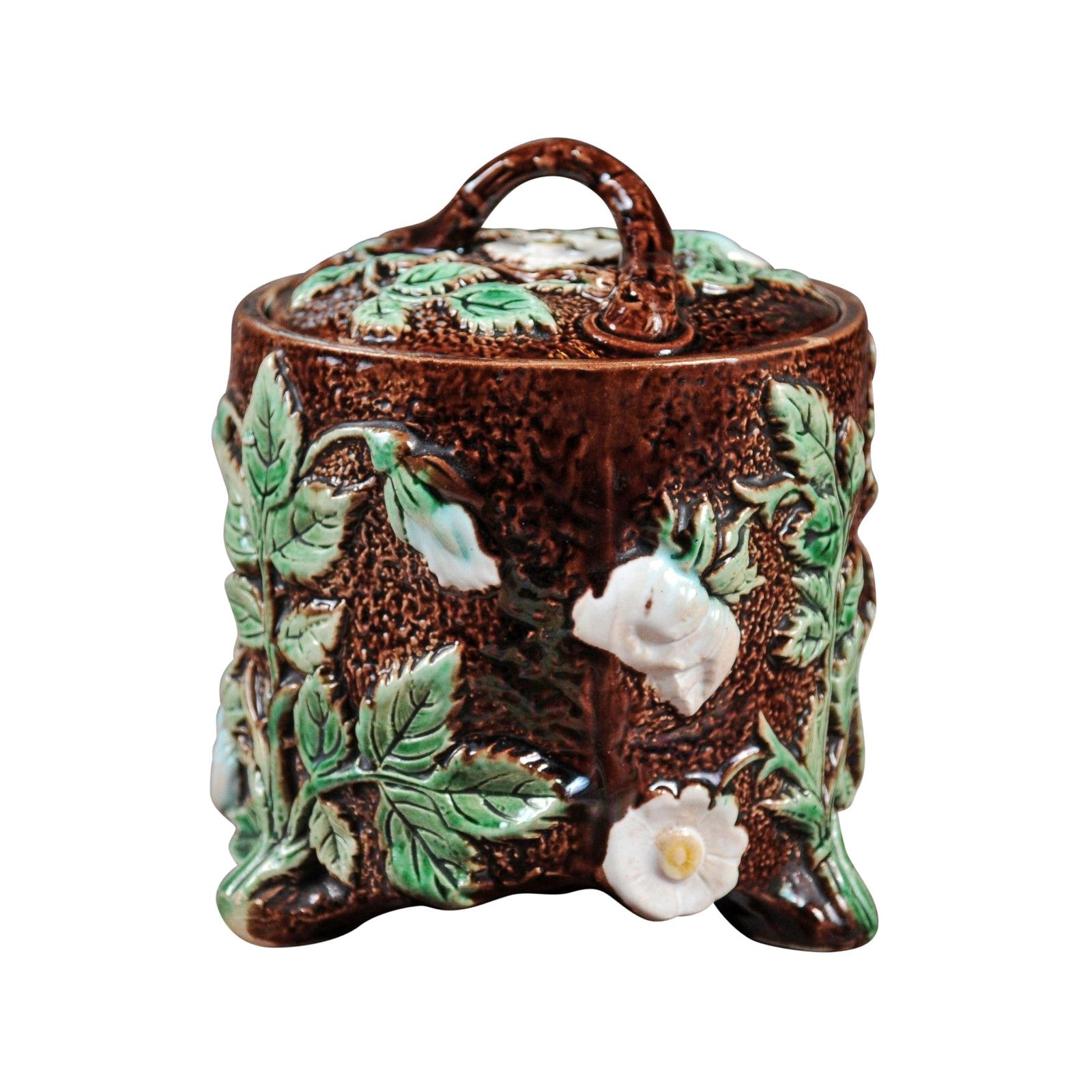 French 19th Century Brown Majolica Lidded Jar with Moulded Floral Décor For Sale