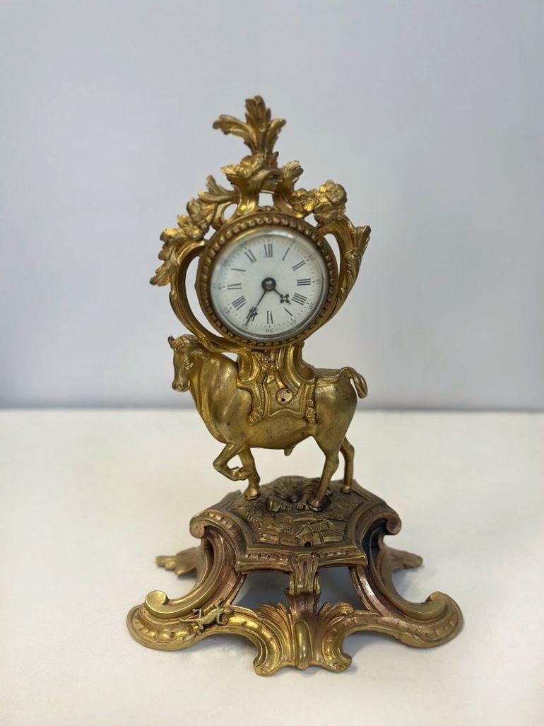 This 19th century French bronze clock showcases the beautiful Rococo style, featuring a regal bull figure atop a floral motif base.
Dimensions:
10.5