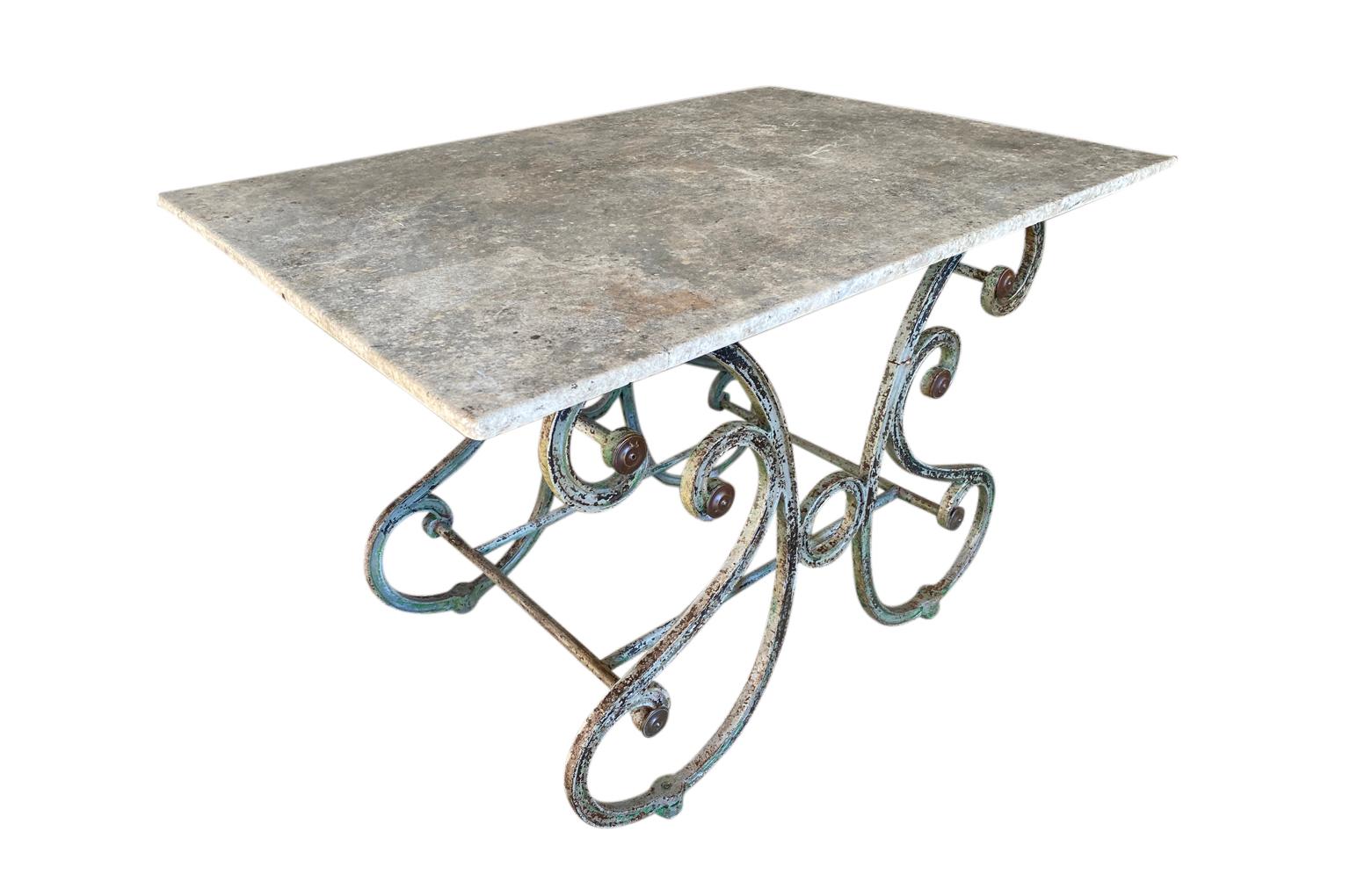 A wonderful later 19th century Butcher's Table from the South of France. Beautifully constructed in the Papillon style - butterfly - with a cast iron base and its original marble top. Tables such as this one, were originally used in the vitrine of a