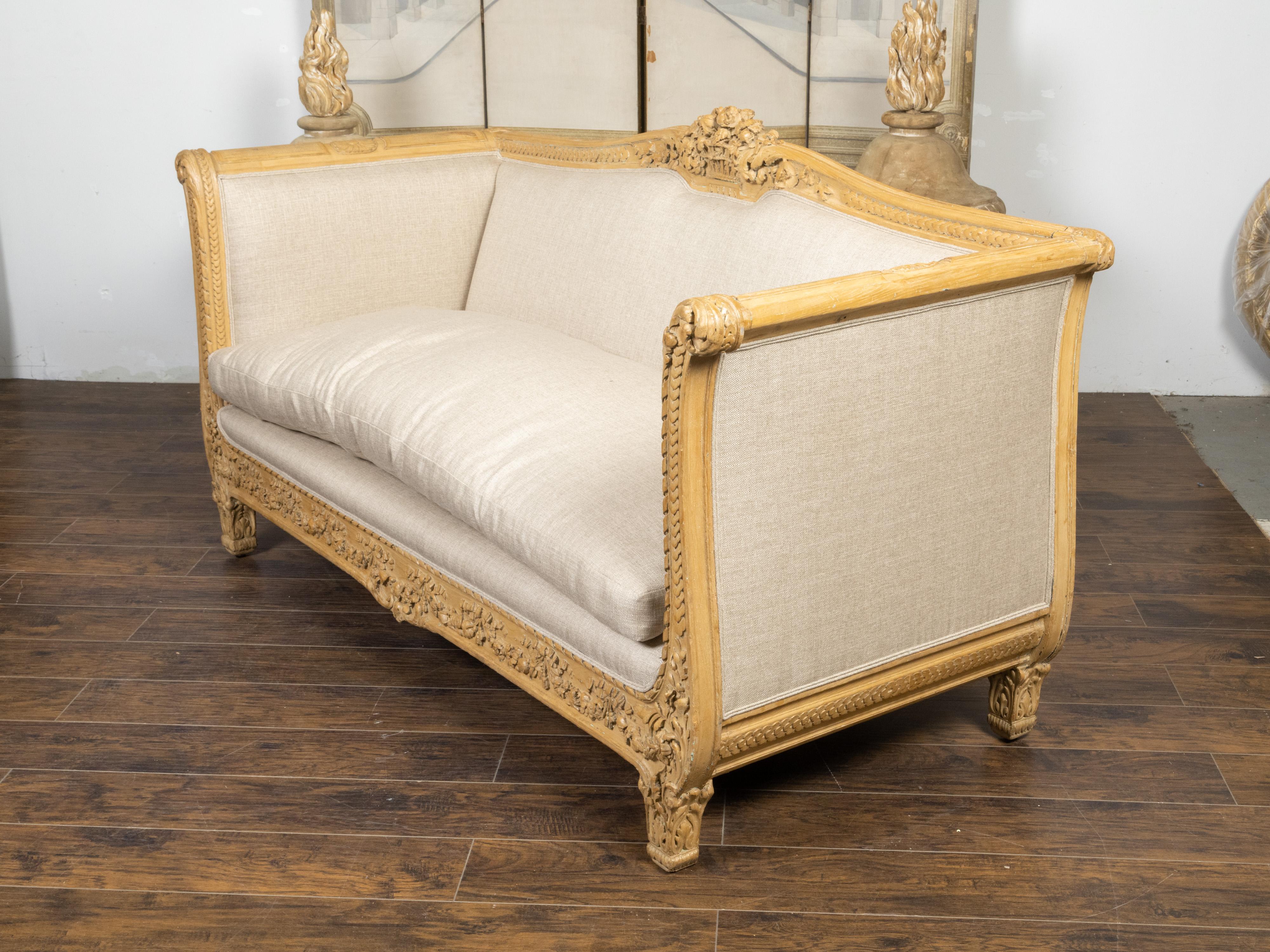 Hand-Carved French 19th Century Canapé with Richly Carved Décor and New Upholstery For Sale