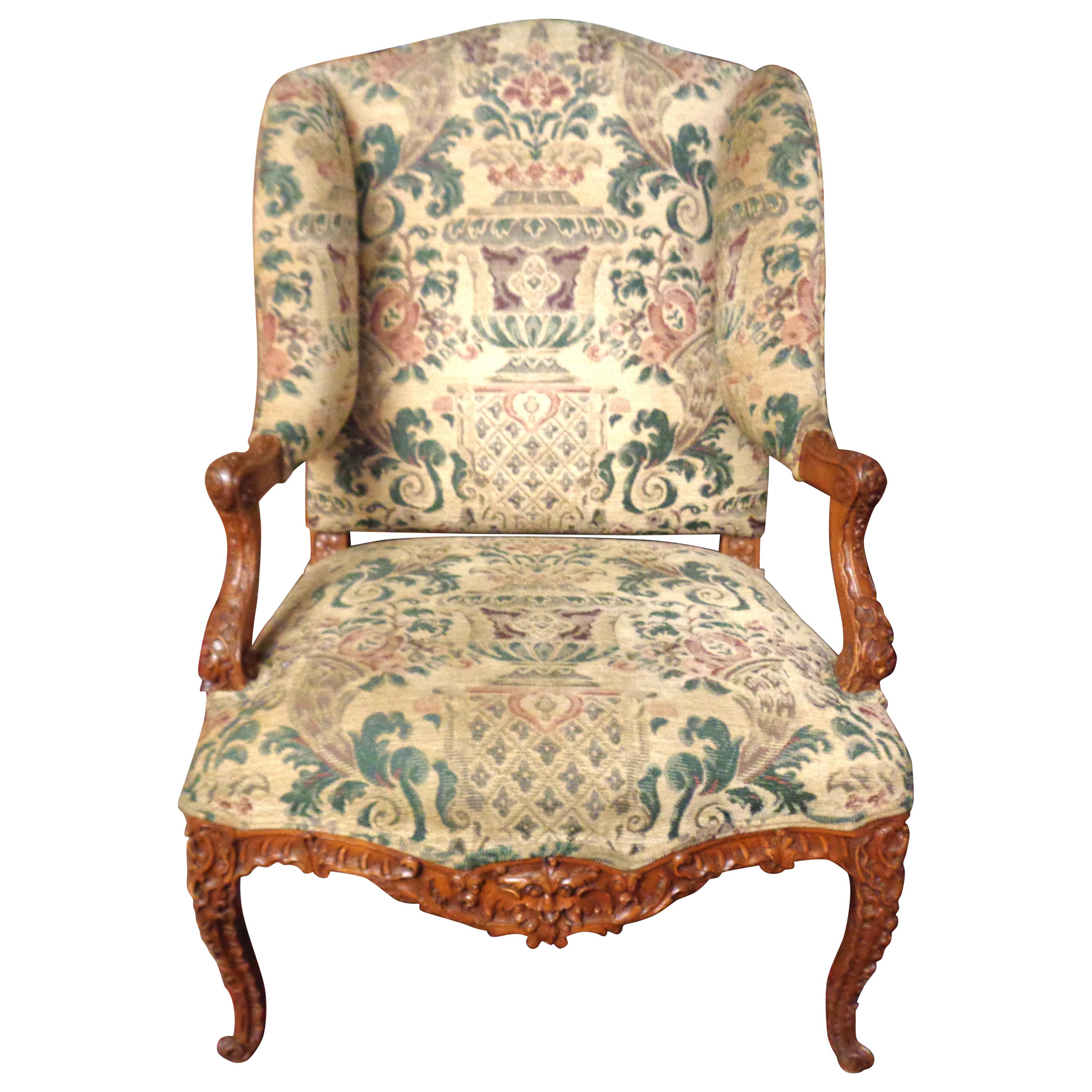 French 19th Century Carved and Upholstered Wingback Chair For Sale