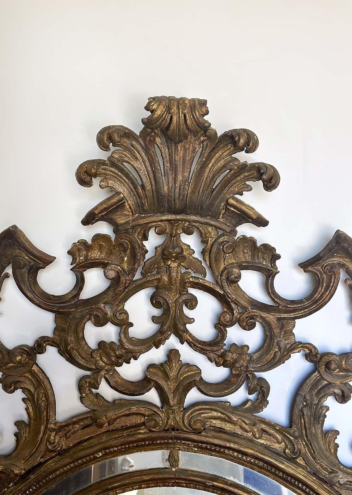 Beautiful 19th Century French carved gilt wood Rococo mirror. This mirror showcases the finest details of the Rococo style and has a very unique carving to it.
Dimensions:
68.5