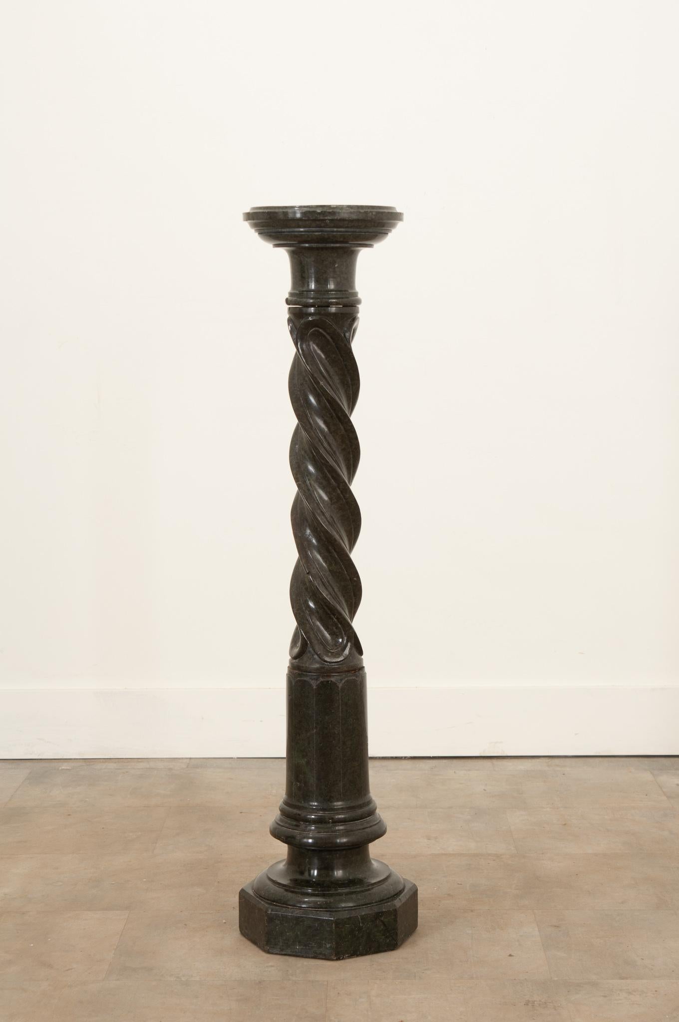 The hand carved black marble pedestal is the perfect accent in any space for an indoor plant or small statue. The top is removable via mortise and tenon joinery. The base has noticeable wear that adds to the overall charm. circa 1850. Make sure to