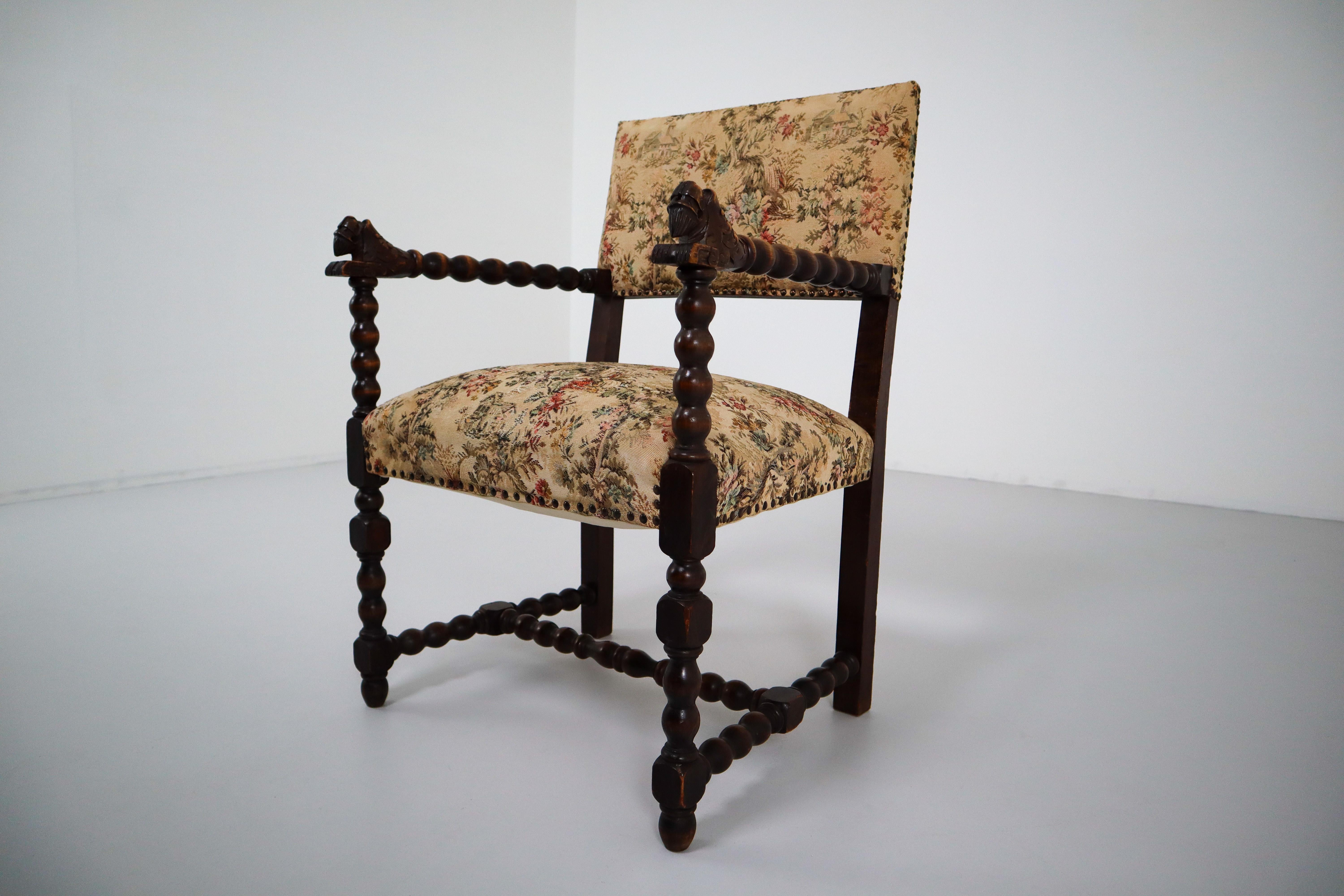 Fabulous carved oak chair from France. Original fabric that shows some minor stains and age appropriate wear. France, 1870.