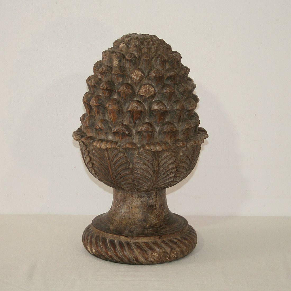 French carved wooden pine cone. Great piece with beautiful patina, France, 19th century. Weathered, small losses.