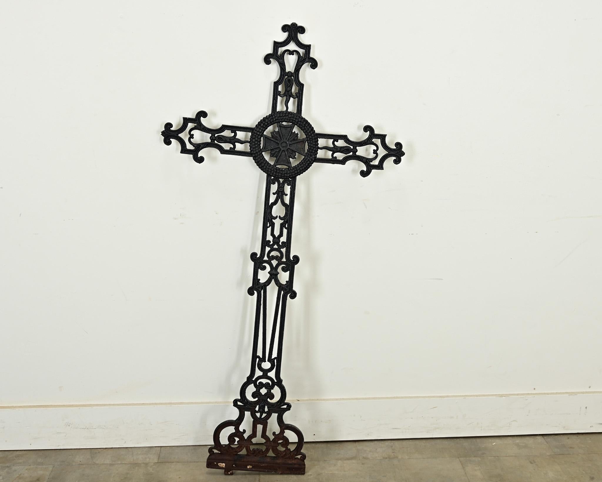 French 19th century cast iron field cross, also known as a pilgrim or pilgrimage cross, with elegant scrollwork and patina. Designed to mark the route for travellers or pilgrims, these large crosses were also placed on the edges of churchyards,