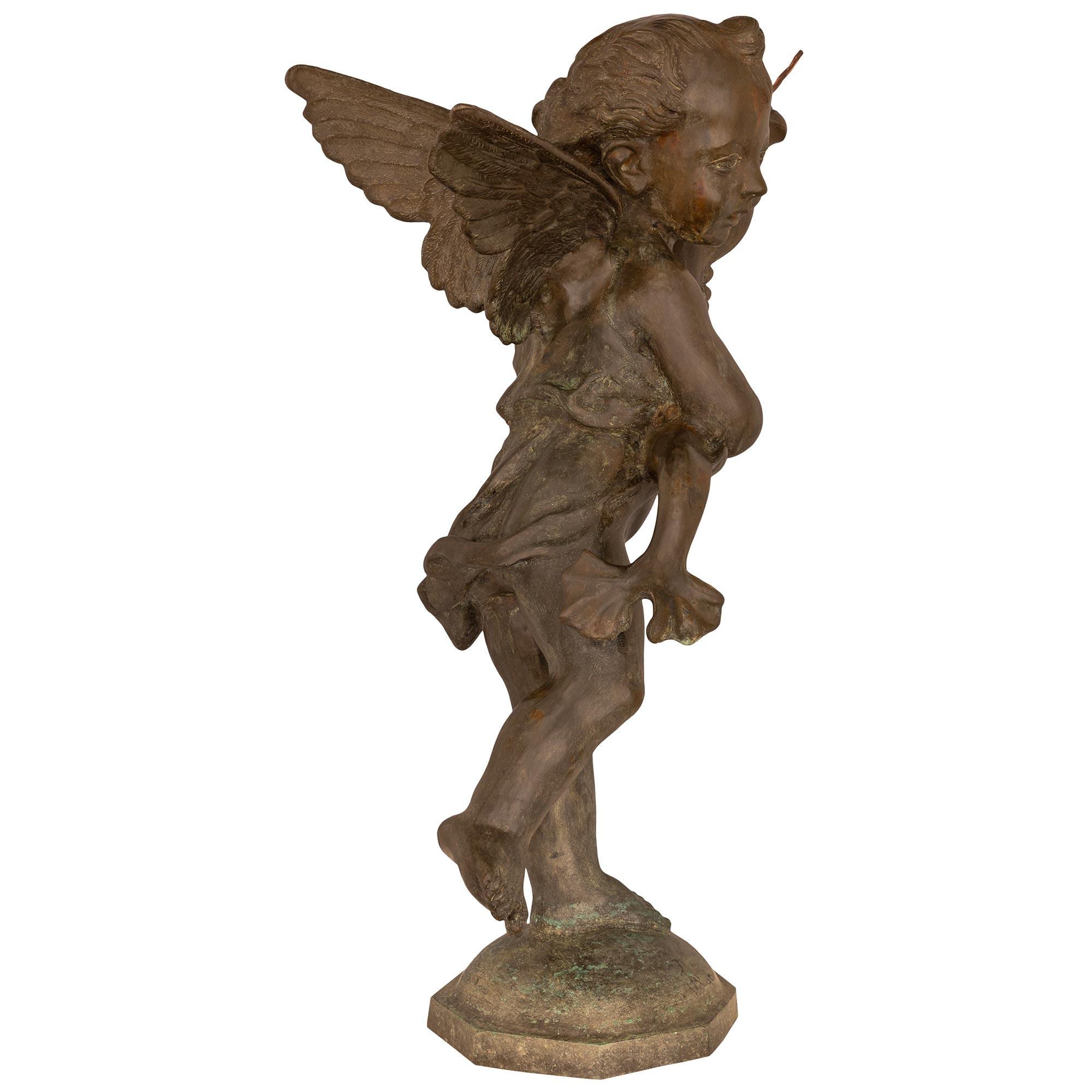 French 19th Century Cast Iron Fountain Of A Young Boy Holding A Dolphin In Good Condition For Sale In West Palm Beach, FL