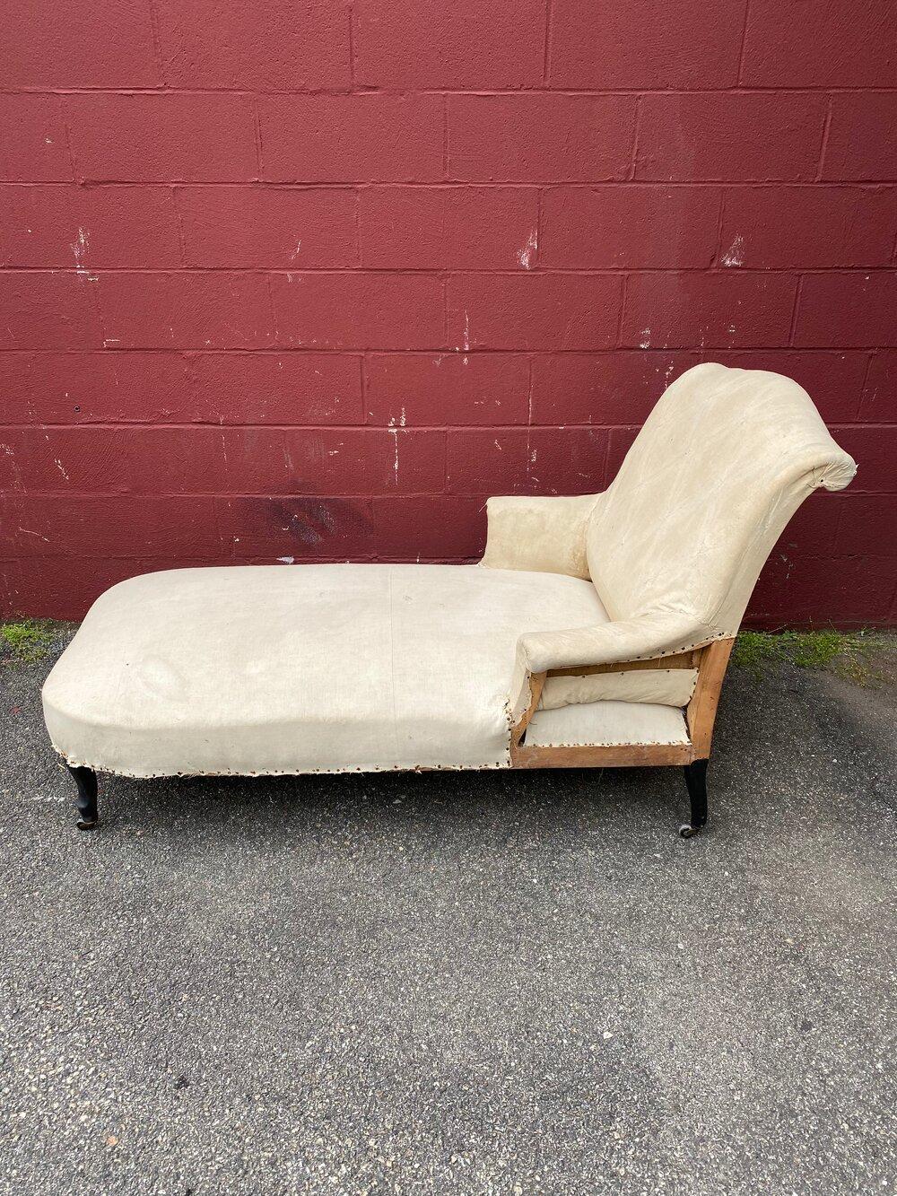 A very elegant French 19th century chaise longue with scrolled back. The original fabric has been stripped off, revealing part of the wooden frame in muslin. Structurally sound and extremely comfortable, a showpiece when reupholstered.

Ref #: