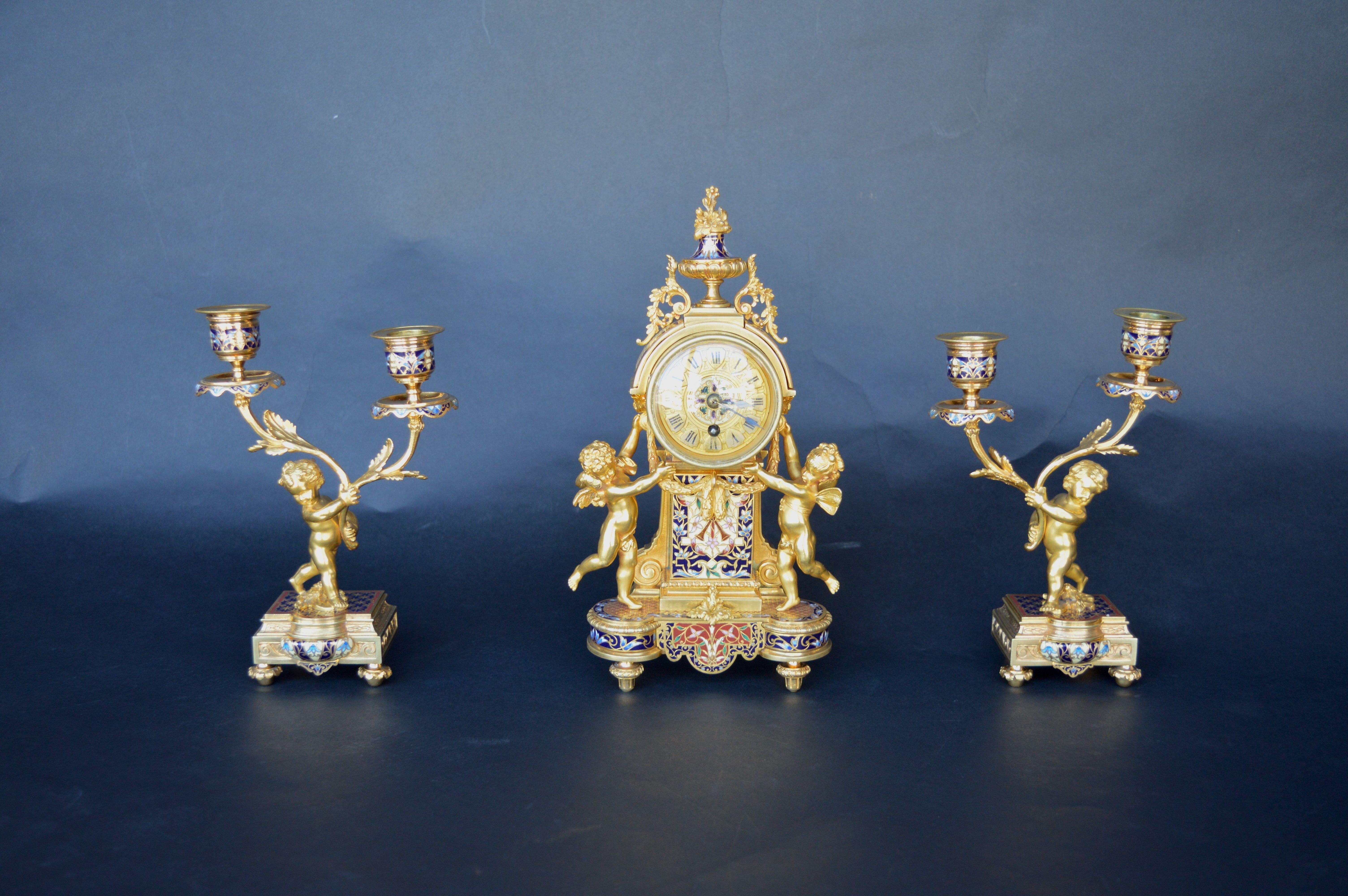 French 19th century champleve enamel clock set signed by Henry Paris

Dimensions:

Clock: 11