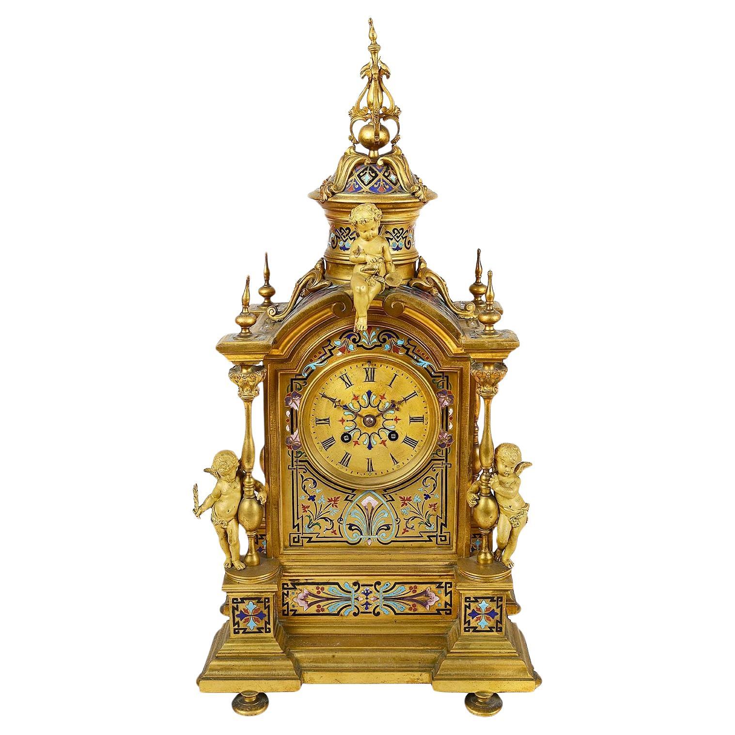 Reloj de chimenea francés esmaltado Champleve del siglo XIX