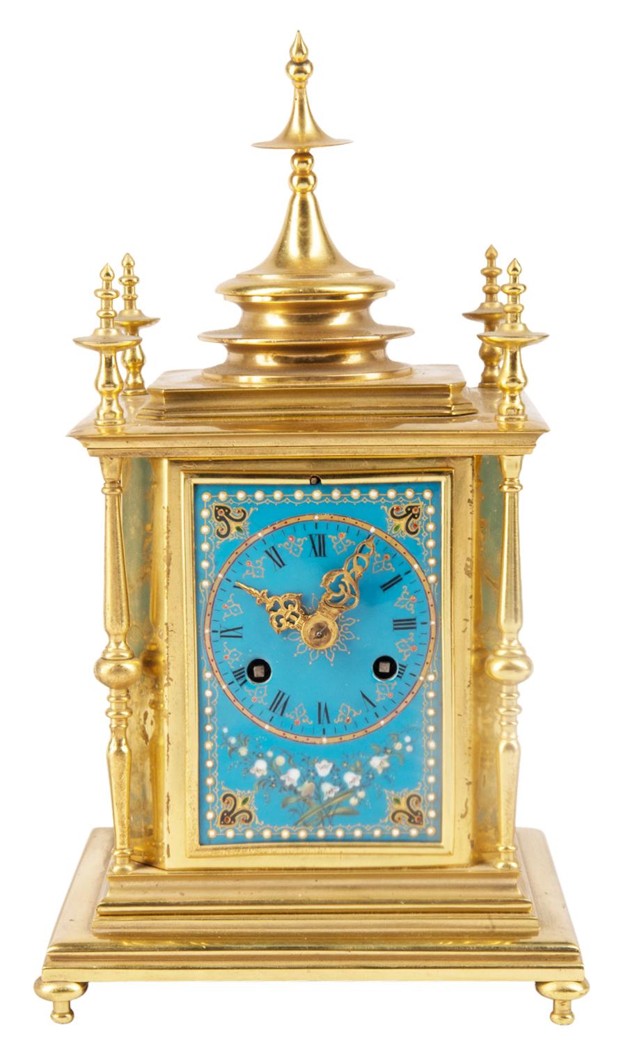 A fine quality 19th century French 'Sevres' style porcelain clock garniture. Having a pair of ormolu mounted lidded urns each with Rams head handles, white bead and floral painted decoration. The clock with three porcelain panels, an eight day