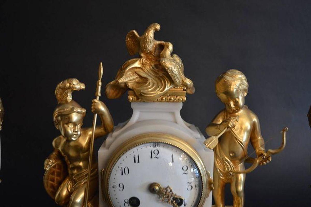 French 19th century clockset with dore bronze and marble.
Urns measure to be 12