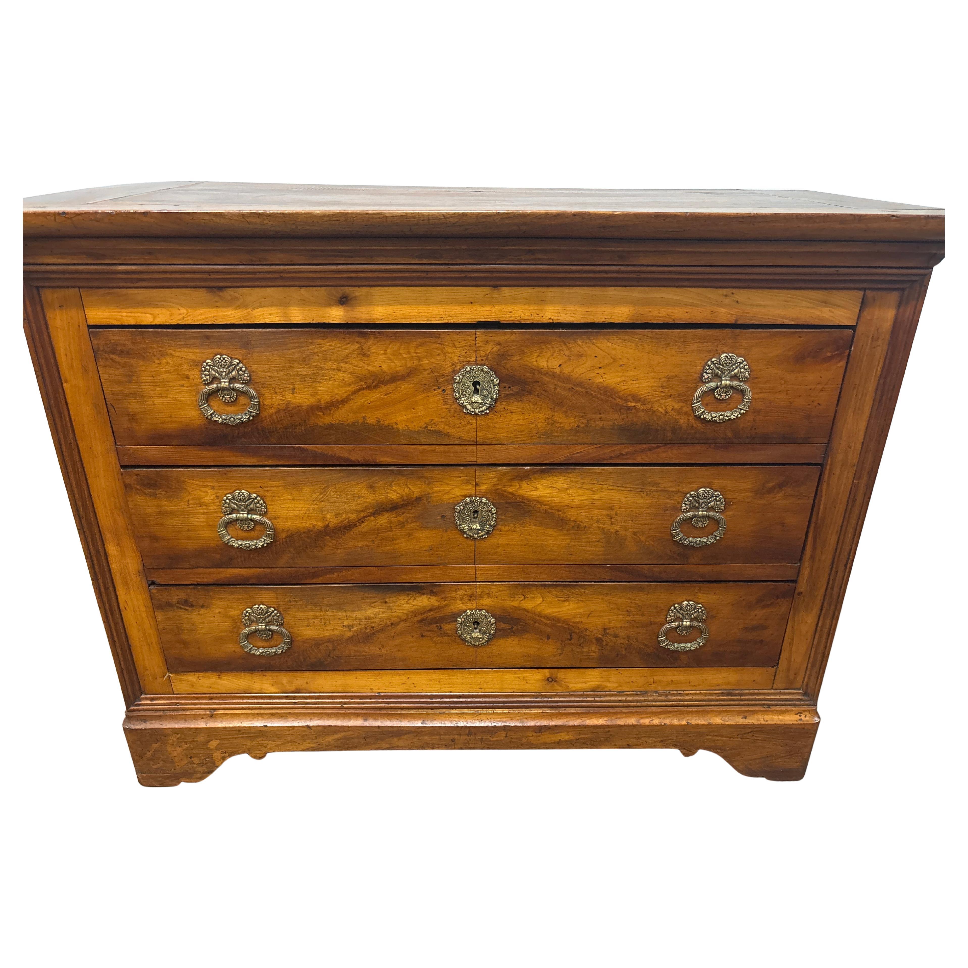 This French Commode is made of a wonderful fruitwood with a wood top.
It has its original hardware.