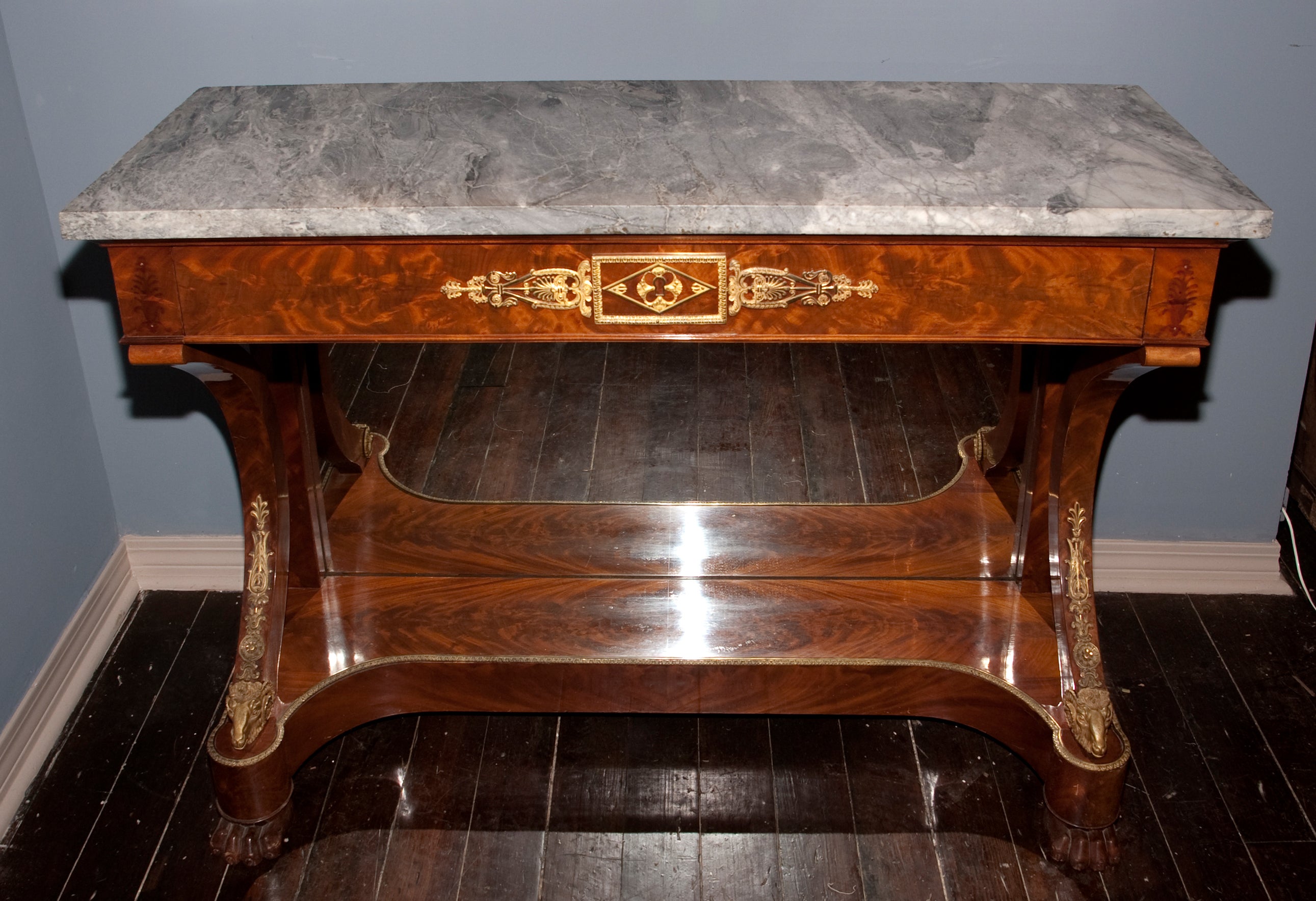 French 19th century Restauration mahogany console with fine bronze d'ore mounts and Bleu Turquin marble top
