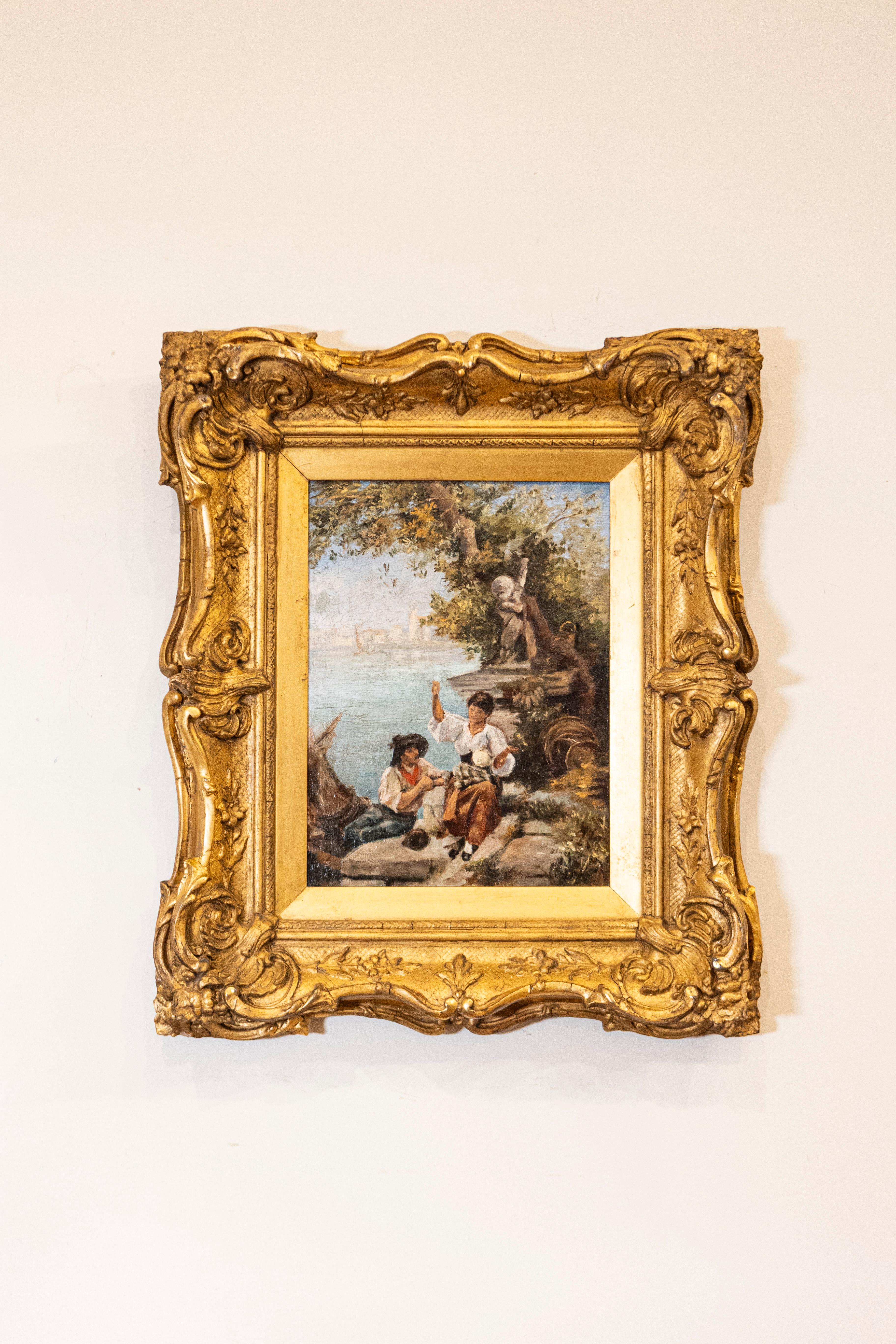 A French 19th century Continental School painting in carved giltwood frame, depicting a scene set in the Venetian lagoon. Created in France during the 19th century, this Continental School painting depicts a humbly dressed man and woman sitting on