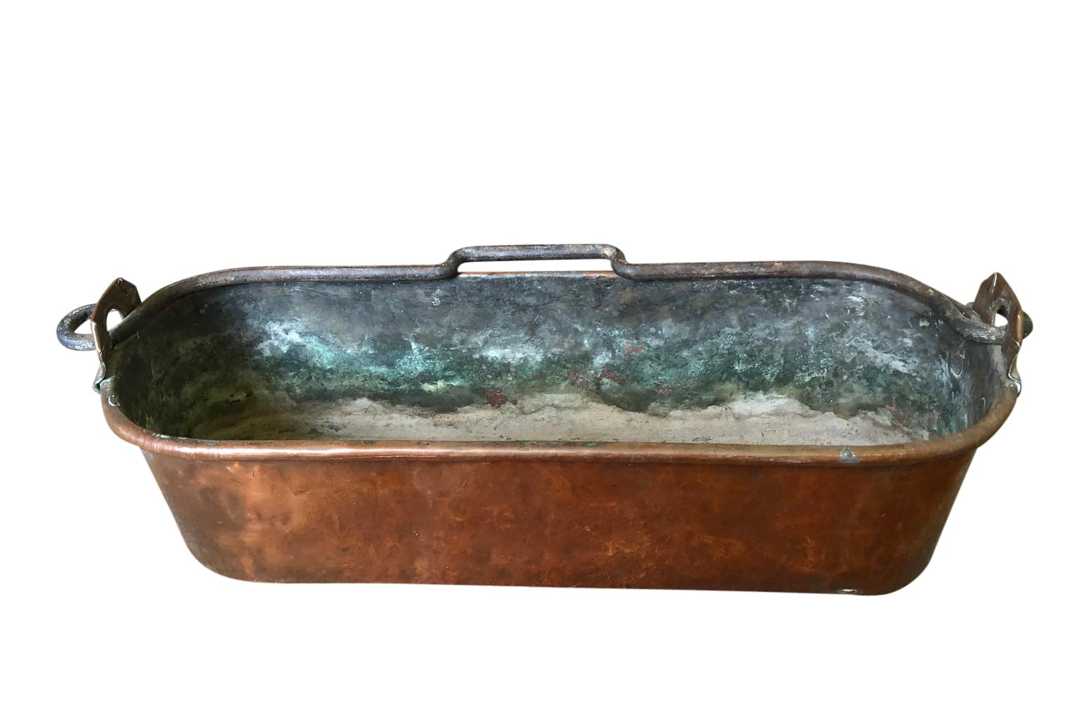 A very lovely mid-19th century copper fish pan - poissoniere - from the South of France. A terrific accent piece for a kitchen, bathroom or living area.