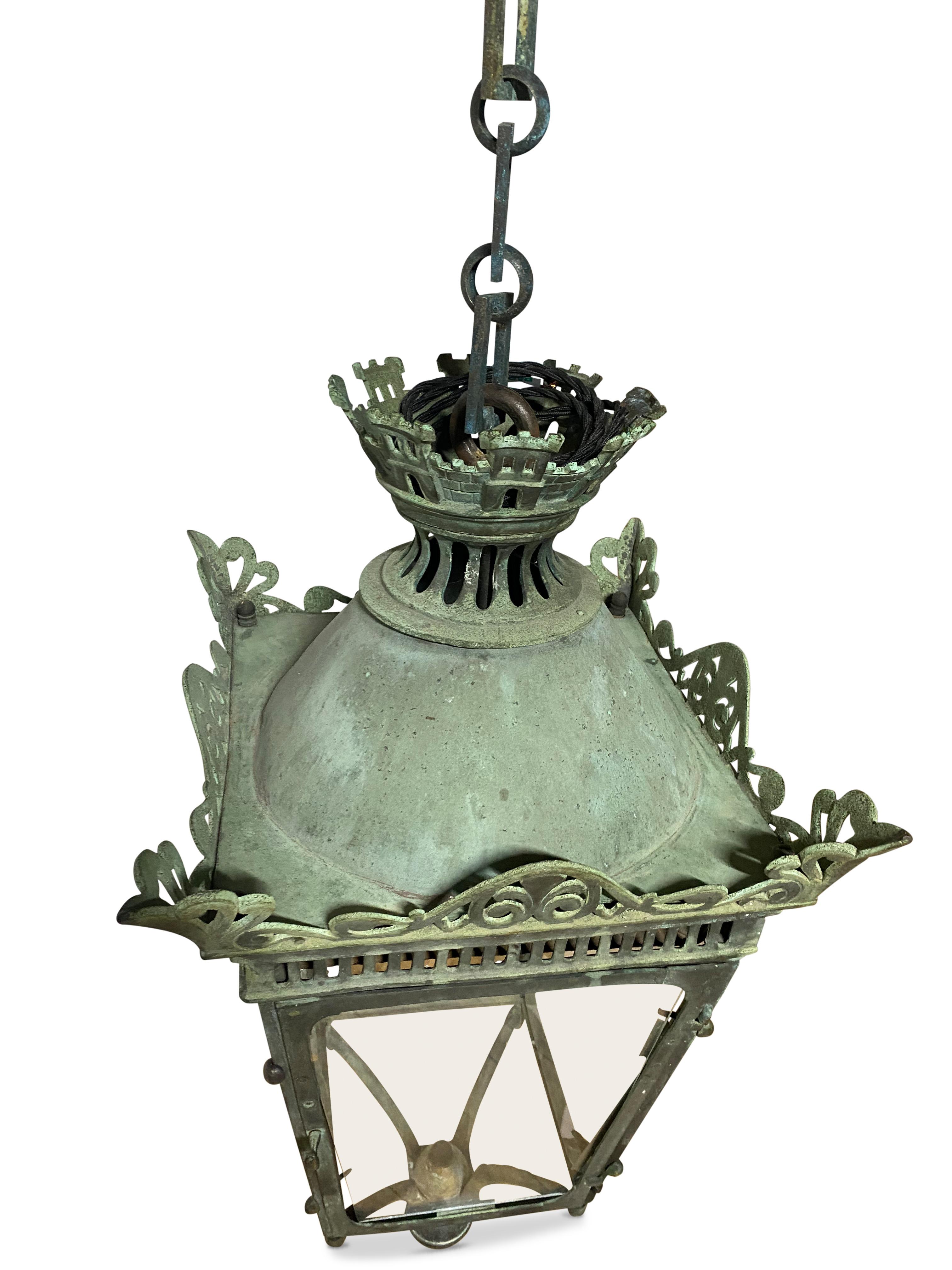 Fantastic rare Late 19th Century French verdigris copper hanging lantern with chain.
This is a fabulous fully glazed verdigris copper lantern featuring beautiful-pierced frame with turret top with a hexagonal link chain that compliments the