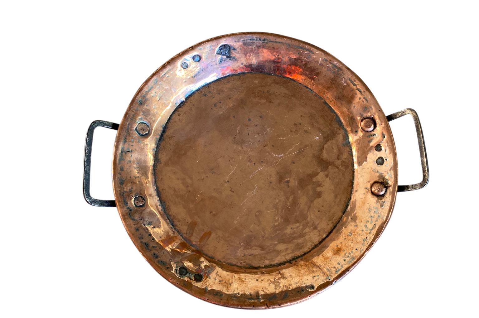 A delightful mid-19th century copper plate with handles from the South of France. A wonderful addition to any copperware collection.