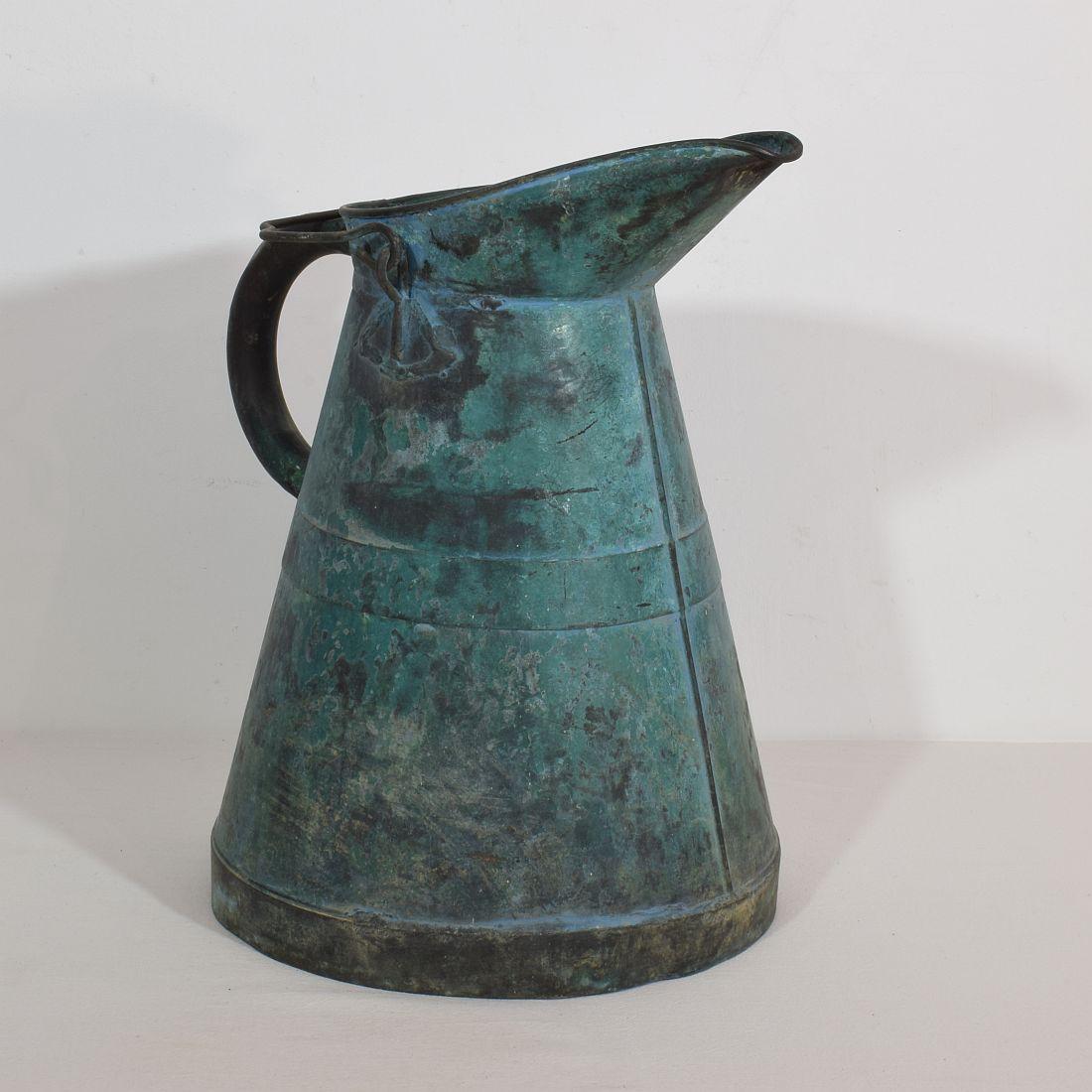 Stunning copper water jug with great patina. France, circa 1850-1900. Weathered.