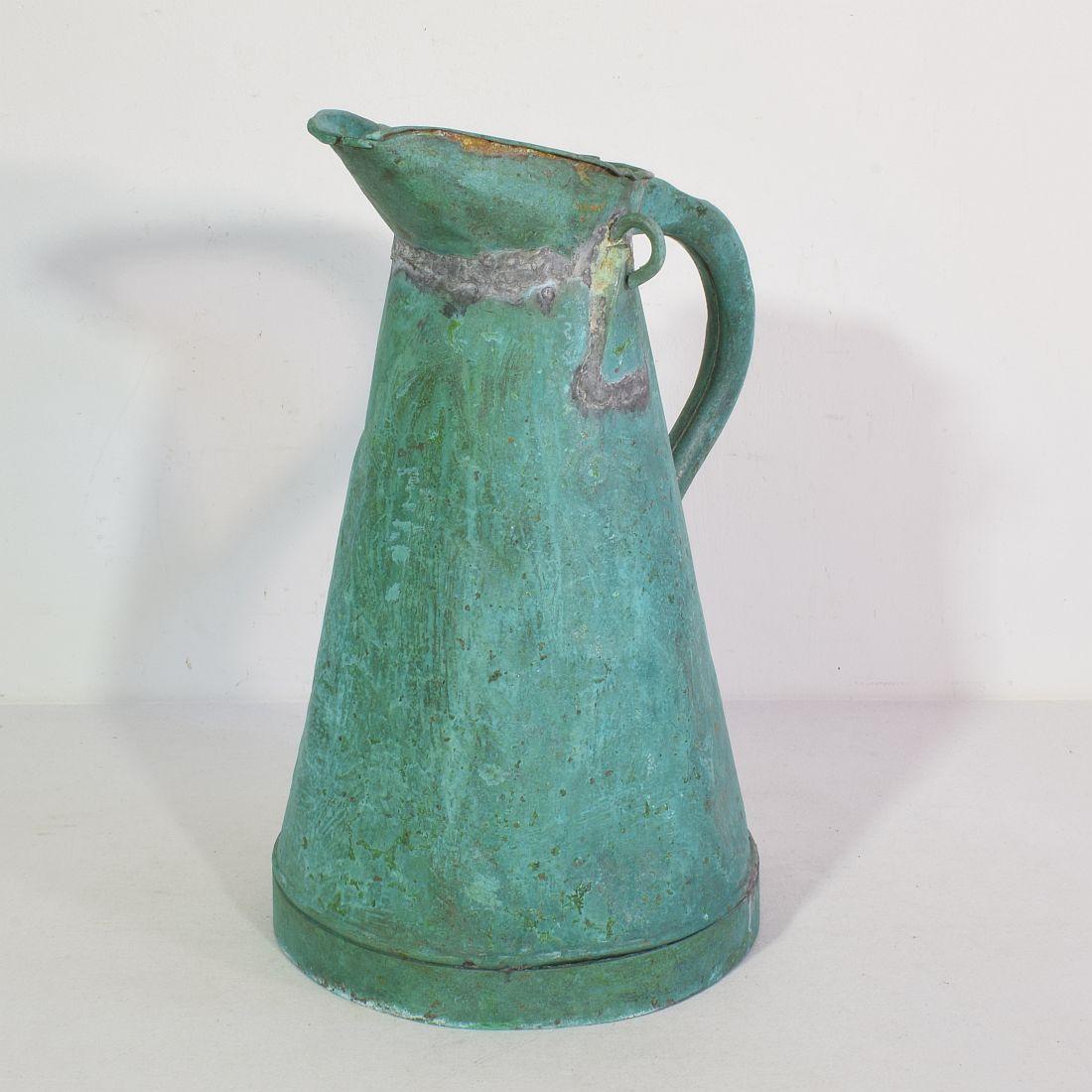 Stunning copper watering can with great green patina, France, circa 1850-1900. Weathered, small losses and old repairs.
Great to use as a decorative object in or outside. Might have leaks.