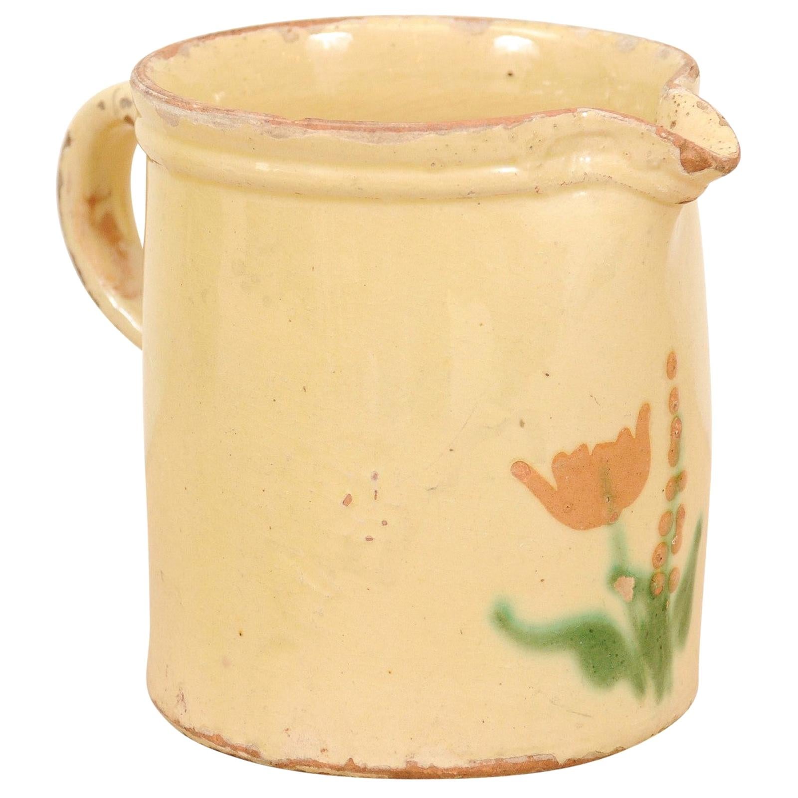 French 19th Century Cream Glazed Terracotta Pitcher with Floral Décor For Sale