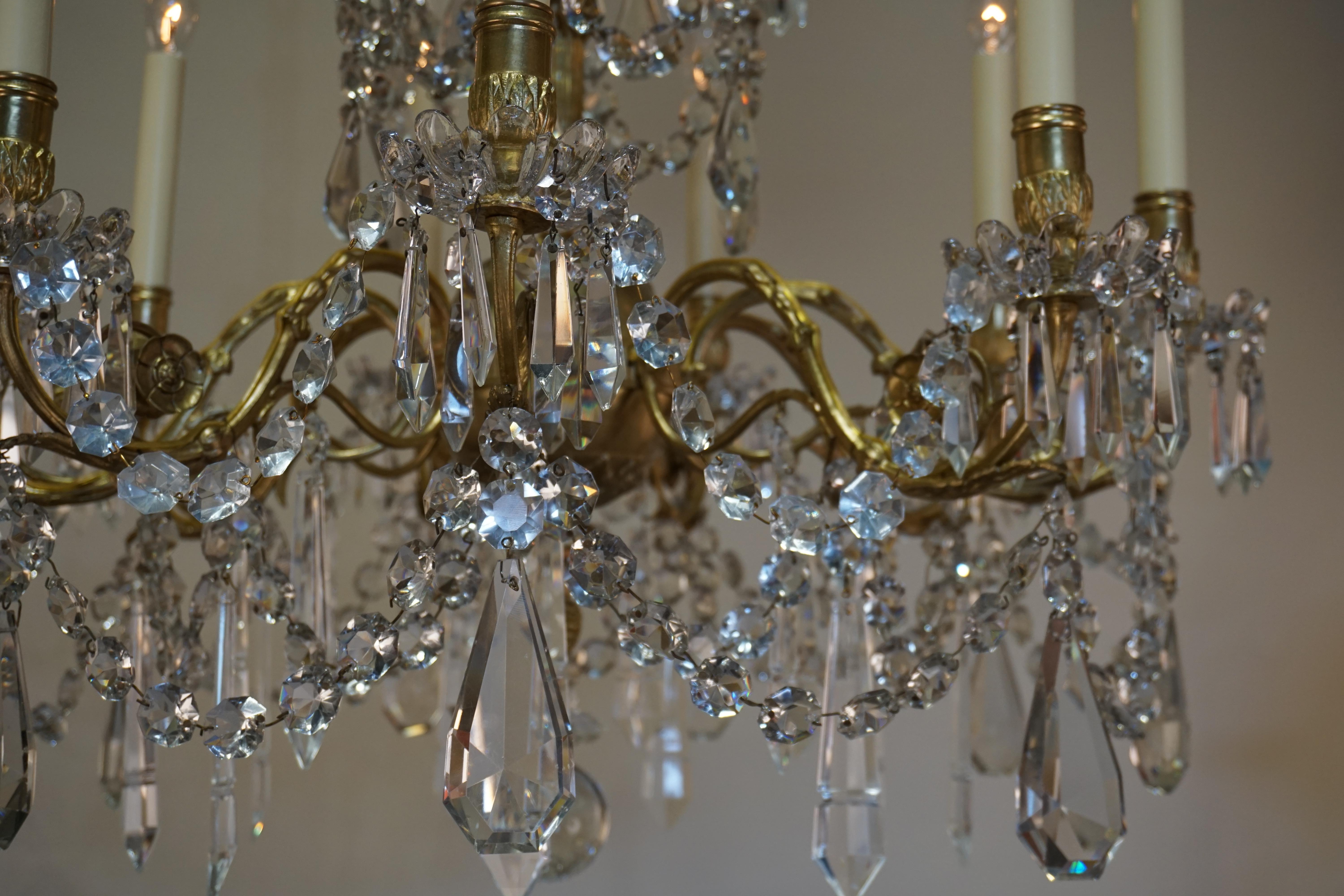 Beautiful late 19th century nine-light crystal and bronze chandelier by Portieux.