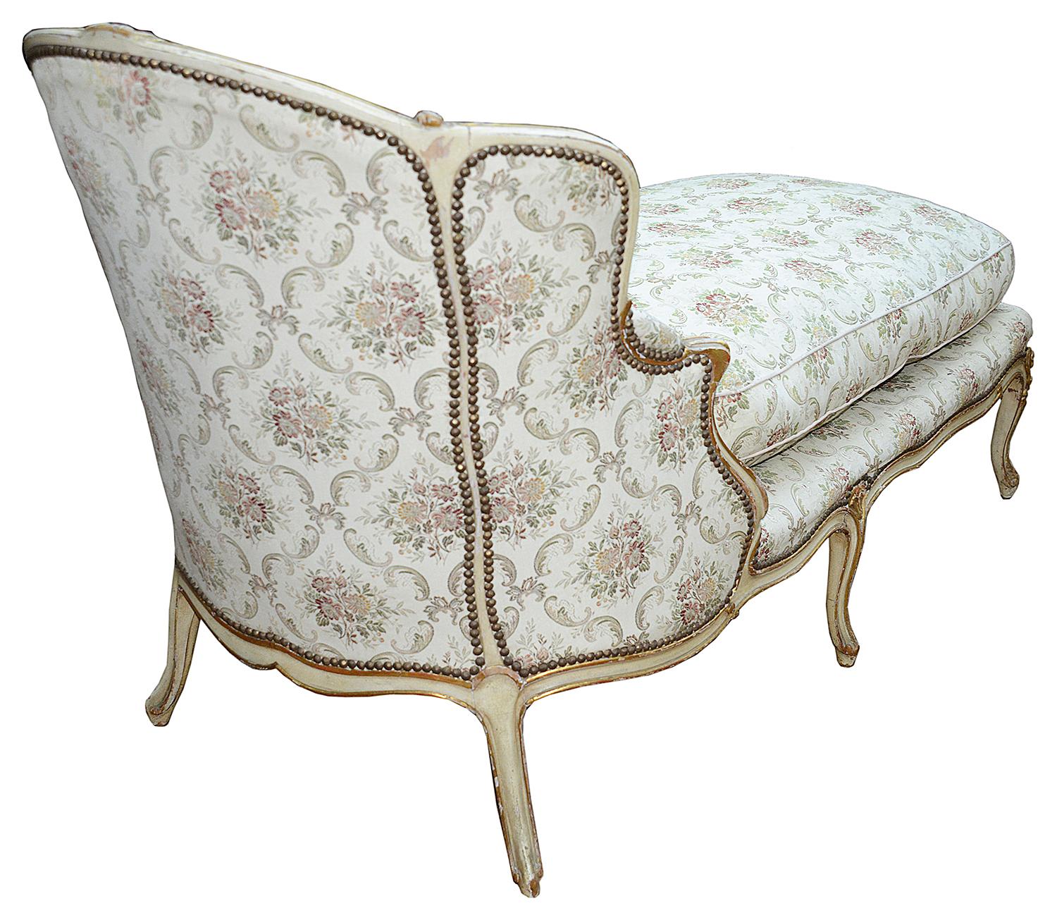 A very stylish 19th century French ivory decorated show wood daybed, raised on elegant cabriole legs.