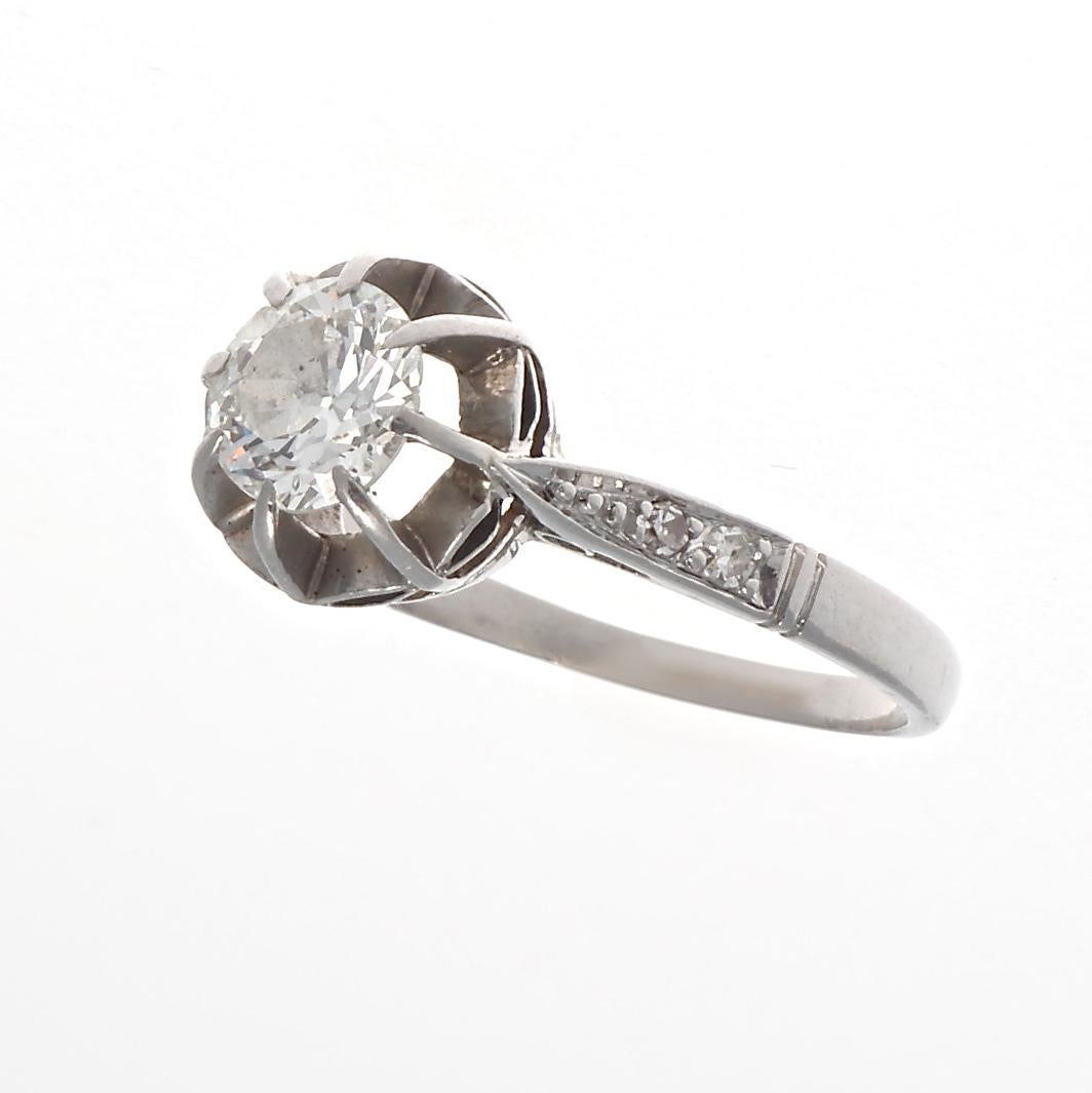 A historical piece to welcome new beginnings. The perfect way to say I love you.  Featuring a 0.60 carat old European cut diamond that is approximately H-I color, SI2 clarity. Crafted in platinum, with diamond accents. Stamped with French hallmarks.