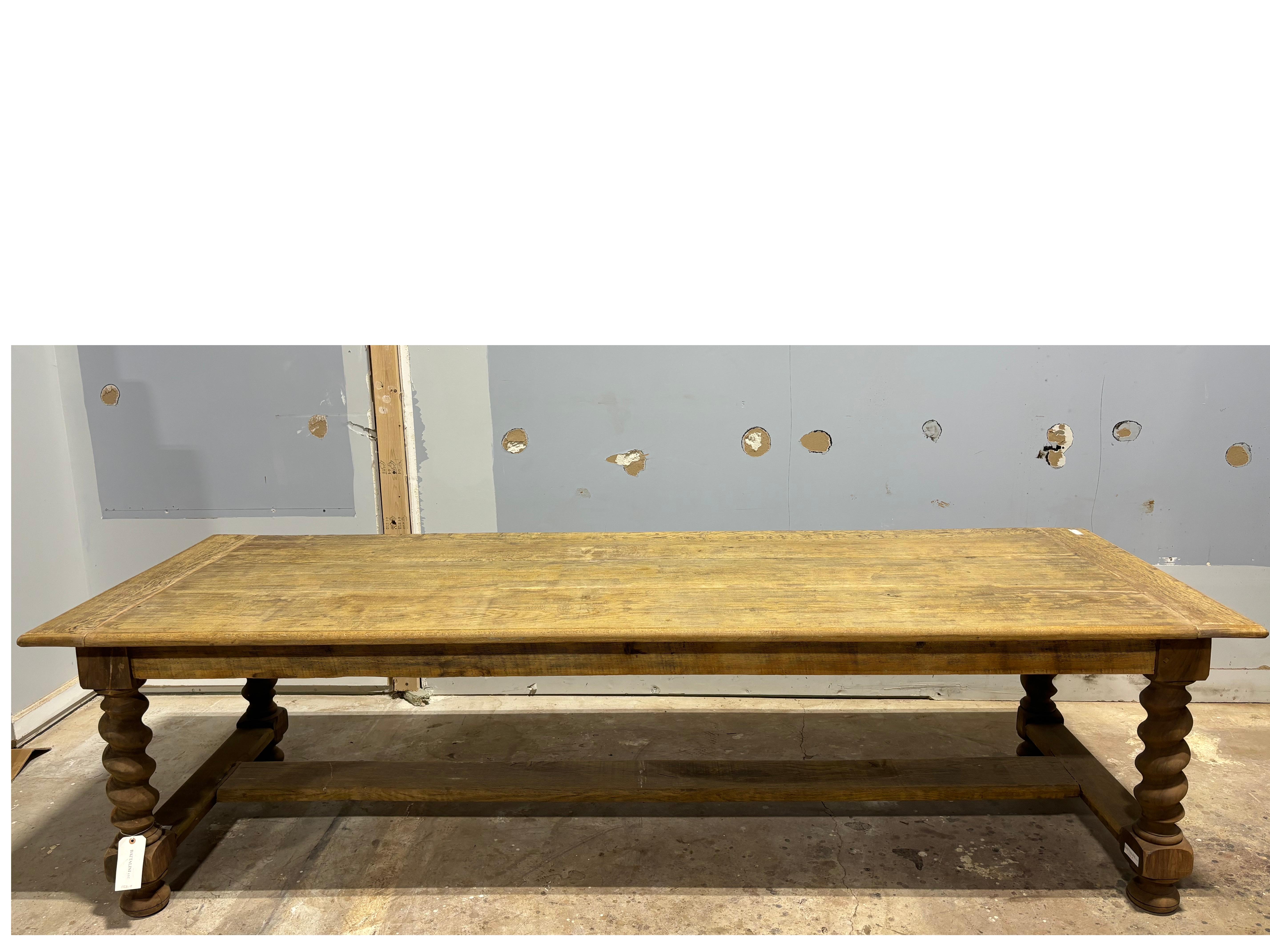 This Long Dining Table is made of oak with twisted feet. It can be place inside or outside on a porch.