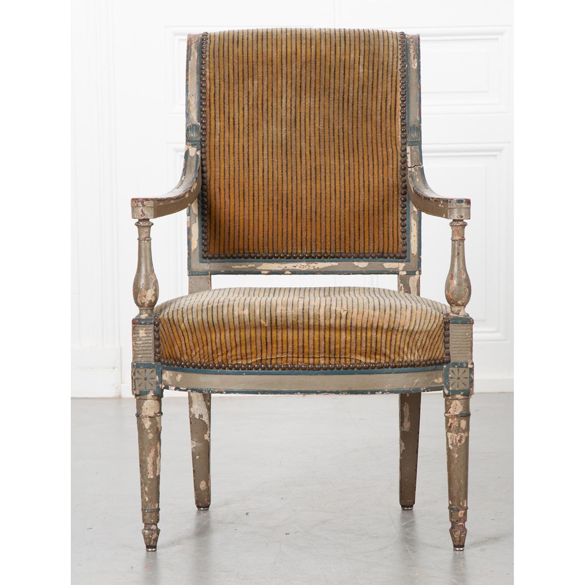 This is a French 19th century painted Directoire fauteuil with its original French blue and gray painted finish and upholstery. Be sure to view the detailed images as it shows the chairs true condition. The chair is sturdy and ready for your choice