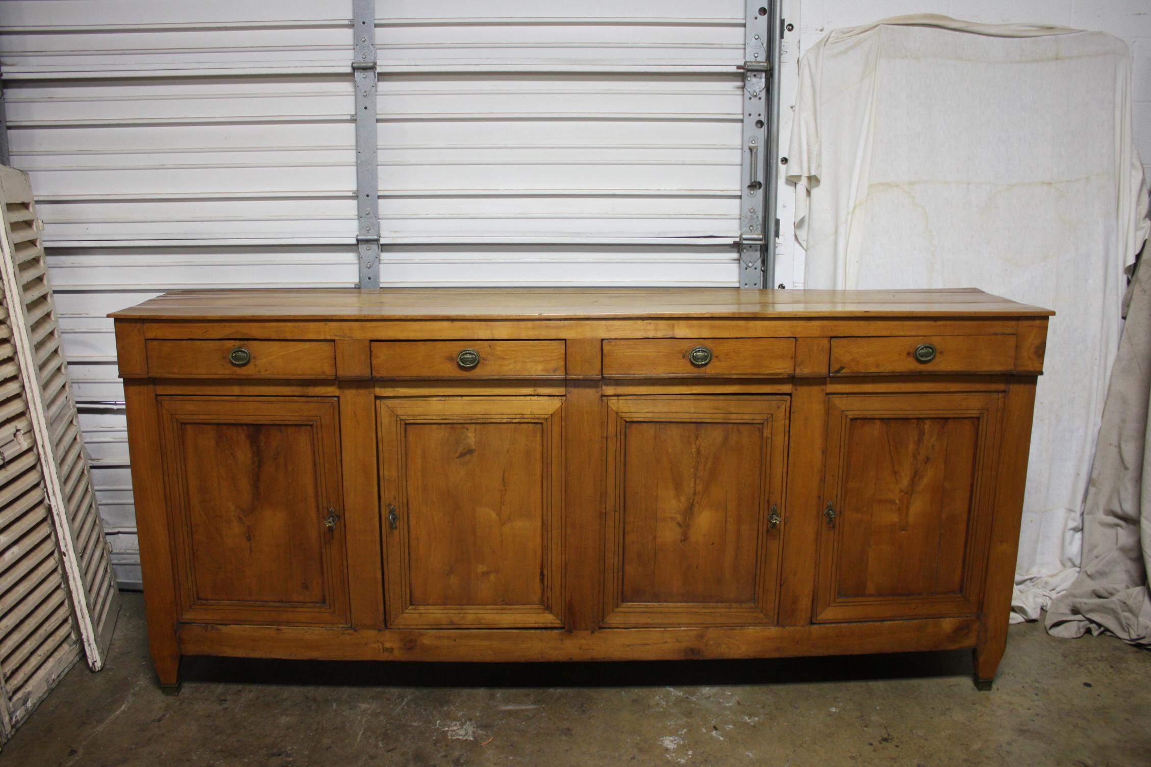 Beautiful French Directoire Sideboard with 4 doors and 4 drawers with black inlay on the doors. Long and narrow, it match very well with modern furniture.