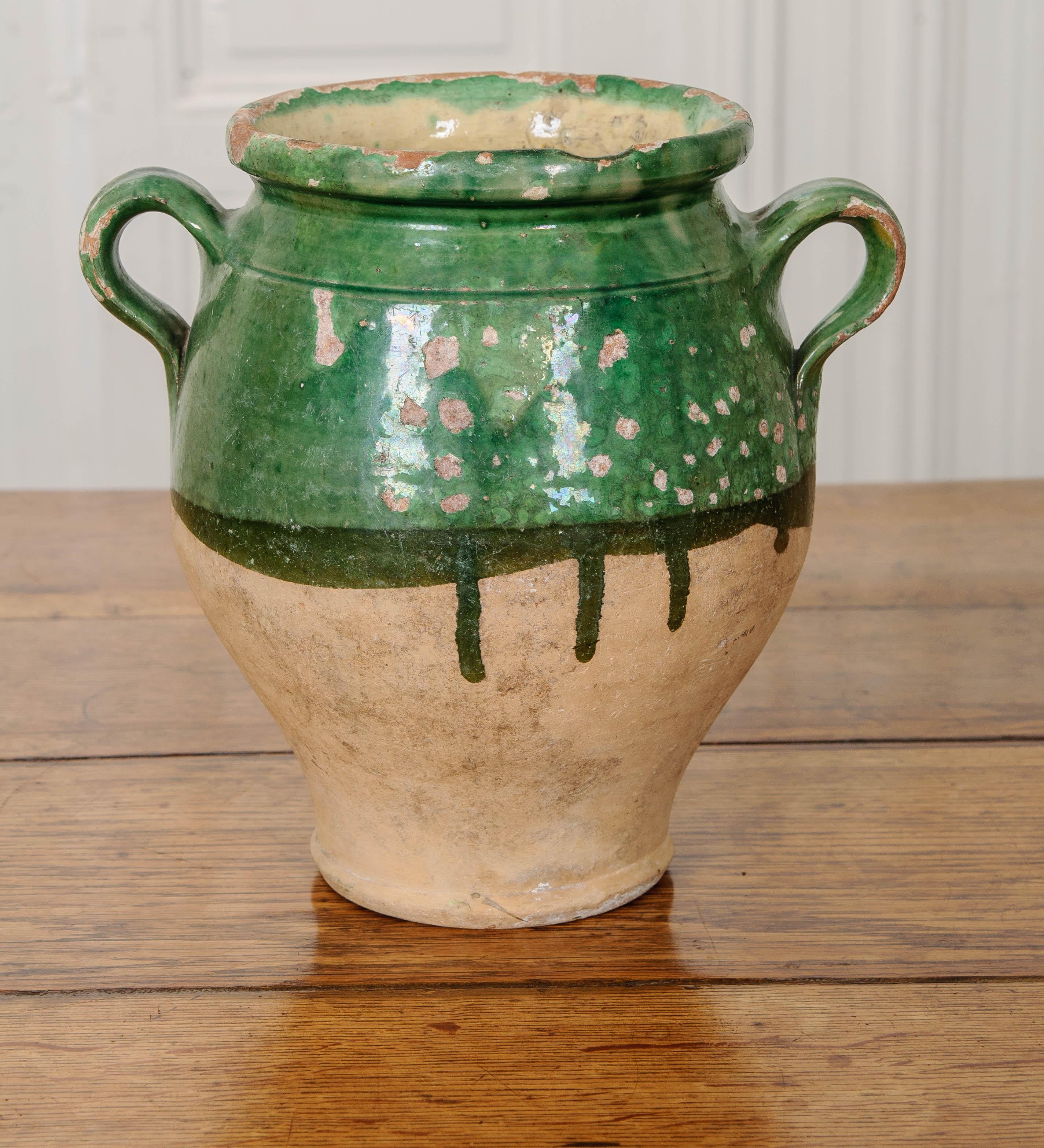 Green-glazed confit jar, from France, circa 1860, for storing duck meat and fat. Most of these jars are only glazed on the top half of the jar and in the inside to save money. The glazed-yellow interior of the jar held the meat and fat inside. For