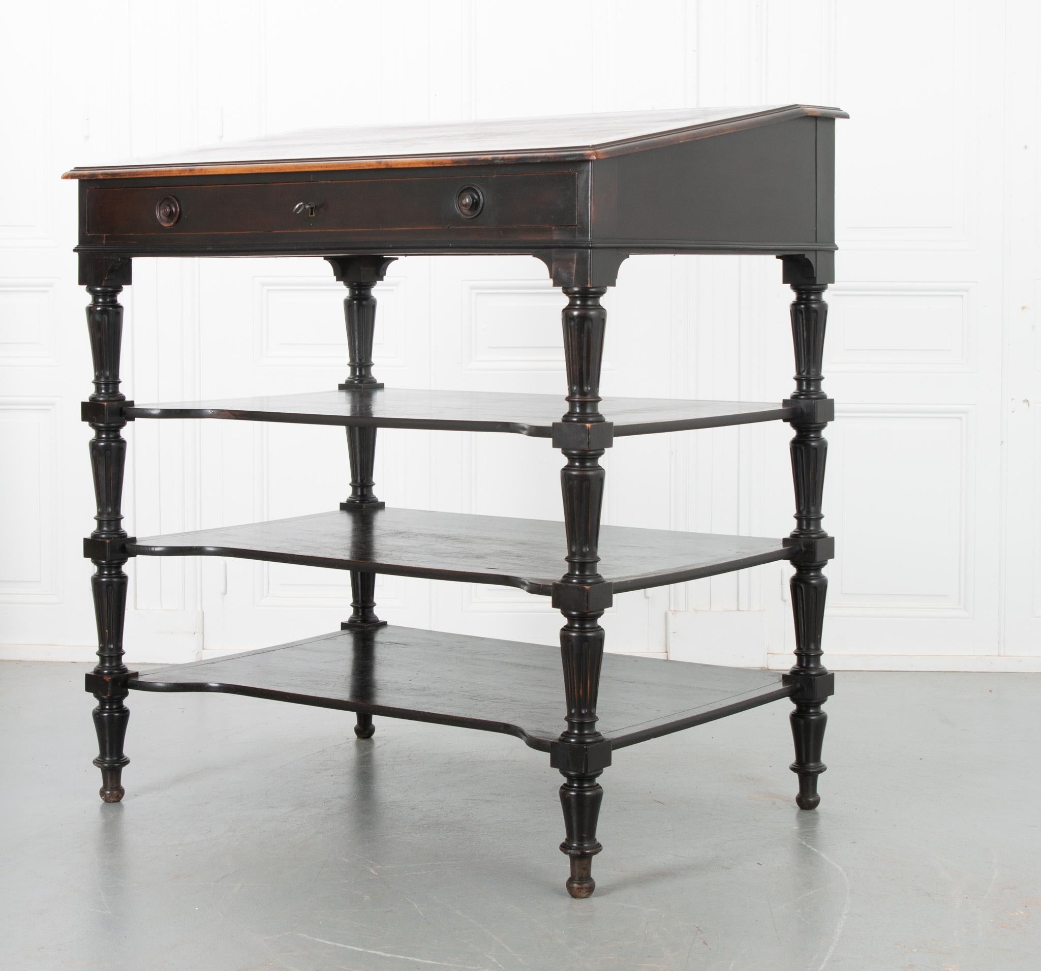 This 19th century drafting table from France is impressive in both scale and construction. Used by architects and drafters, the desk’s tilted surface brings the back of the table towards the artist, minimizing reach, and saving their aching backs.
