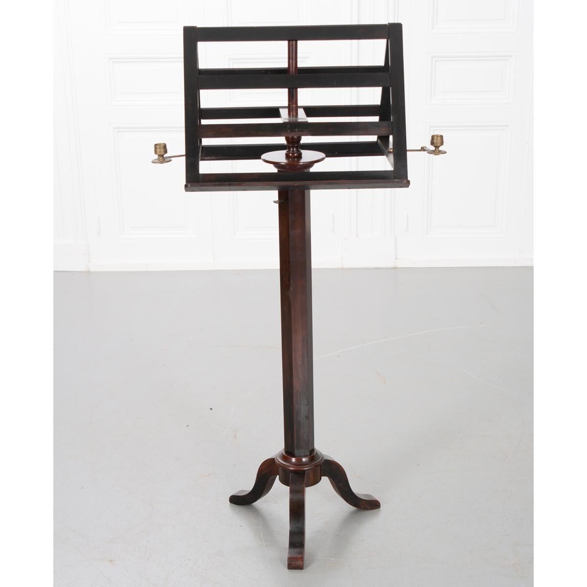 A beautiful duet sheet music stand with sturdy resting surfaces on each side for sheet music or books as well as two adjustable brass candle holders. The stand itself is 19”W without the candle holders extended and can be adjusted for height using